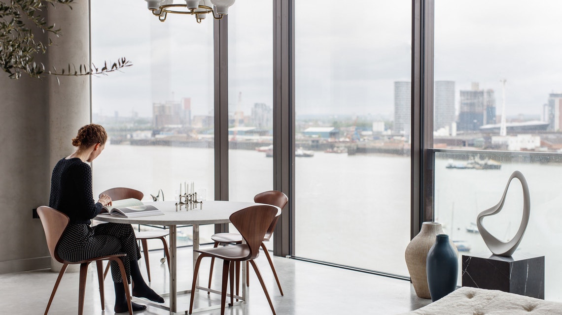 Person sat at a table in a well lit room