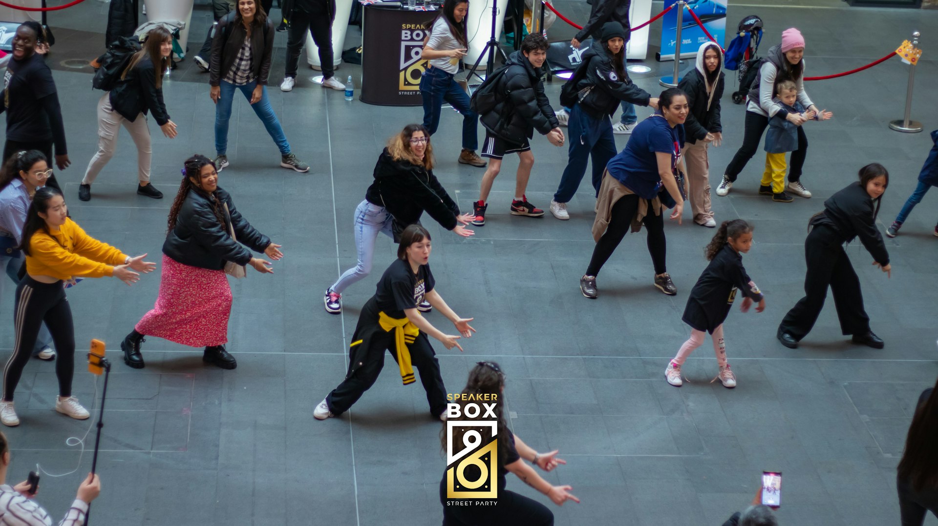 A group of people dance 