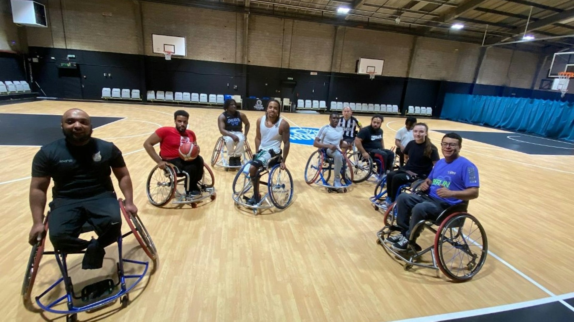 A wide shot of basketball players