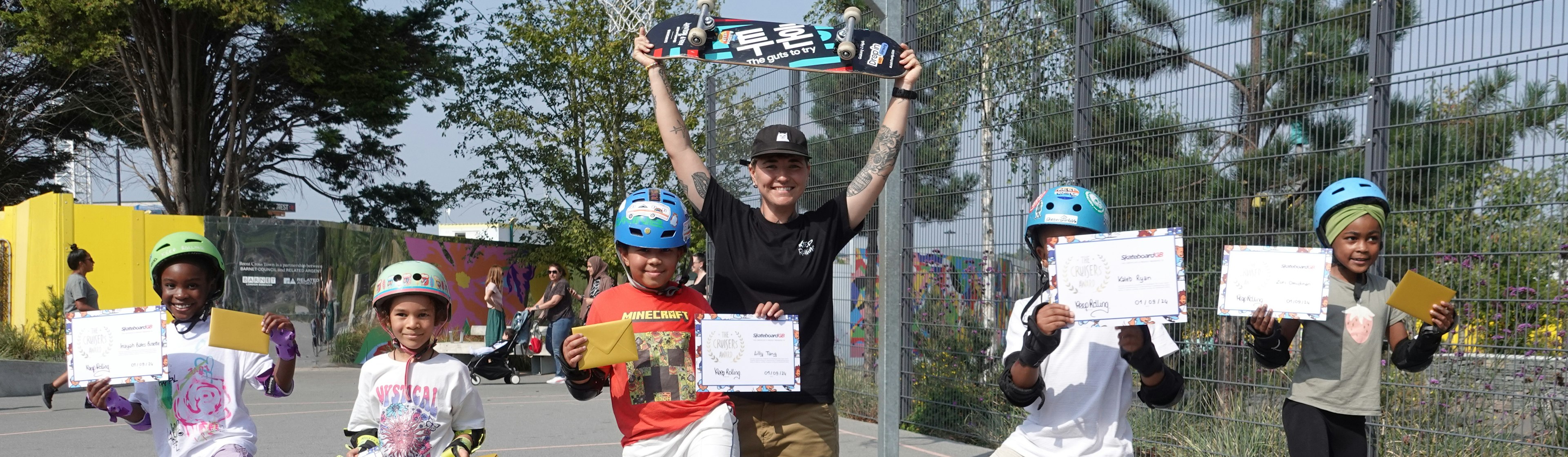 Children show their skateboarding certificates