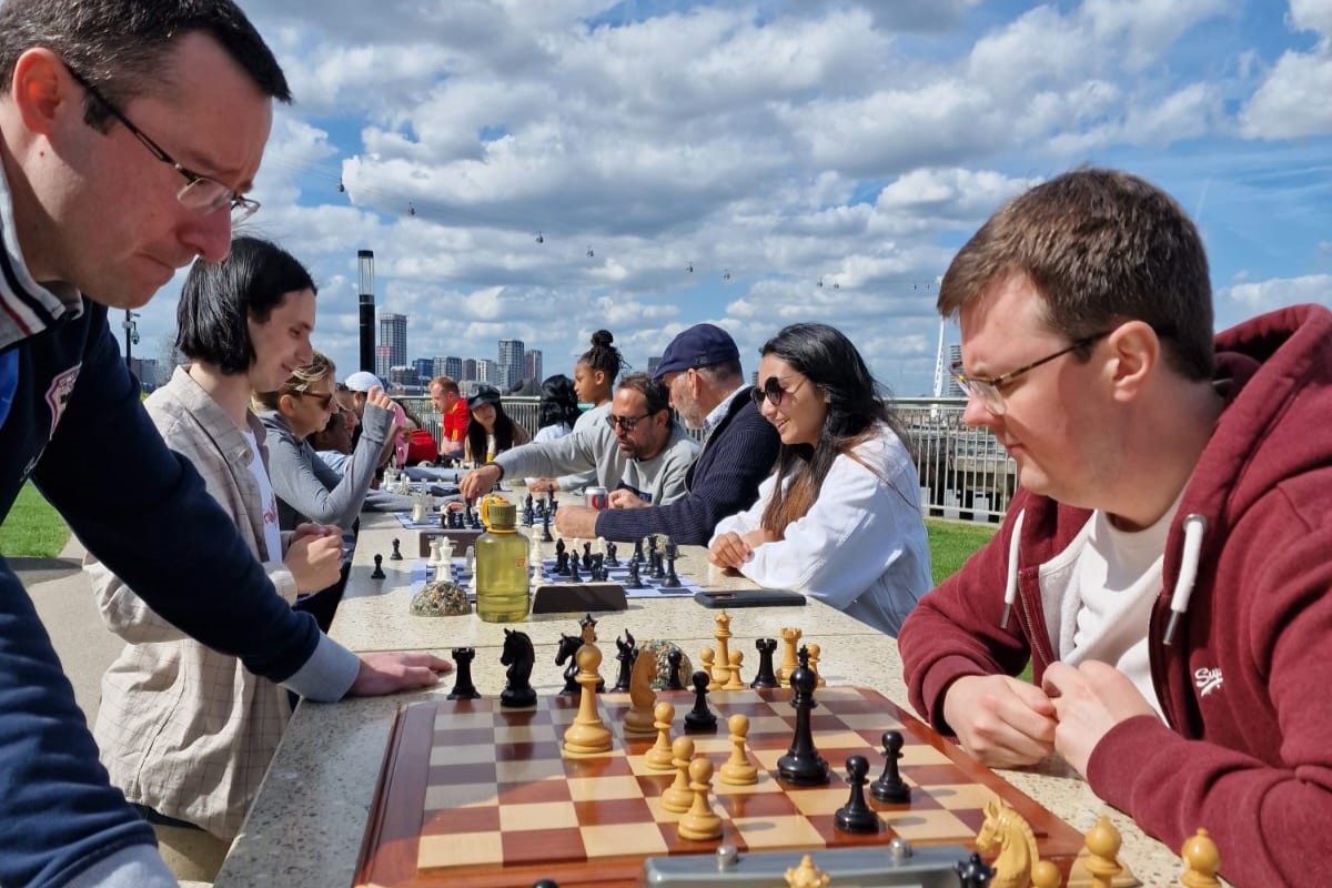 People playing chess in the sun