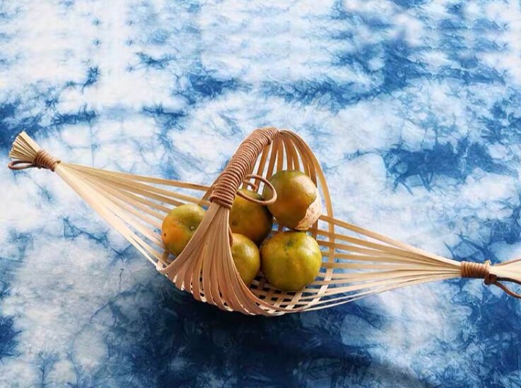 A bamboo basket with some fruit inside
