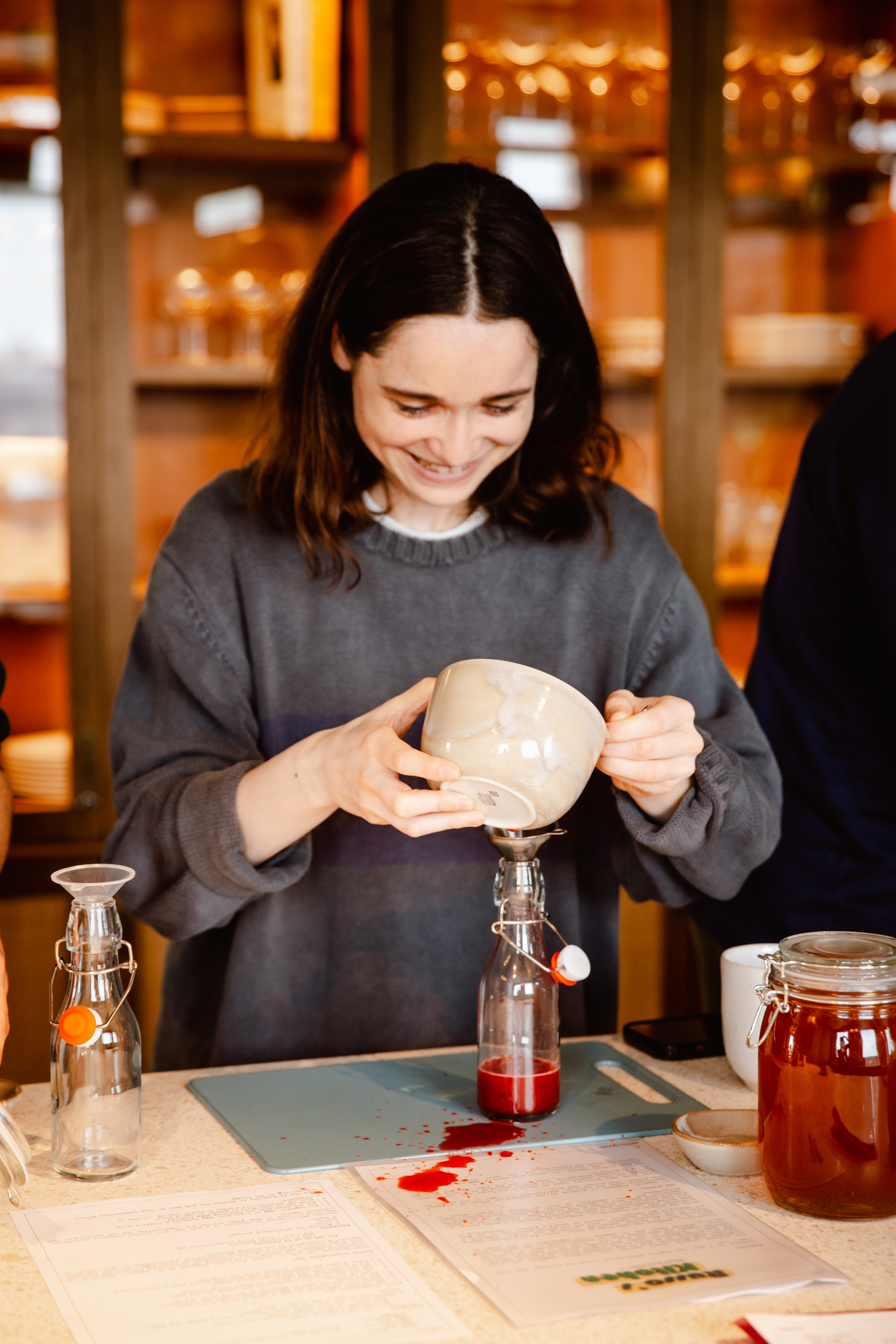 A lady makes kombucha