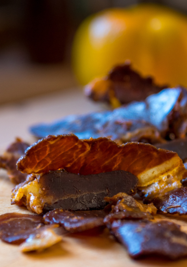 Sliced biltong on a chopping board