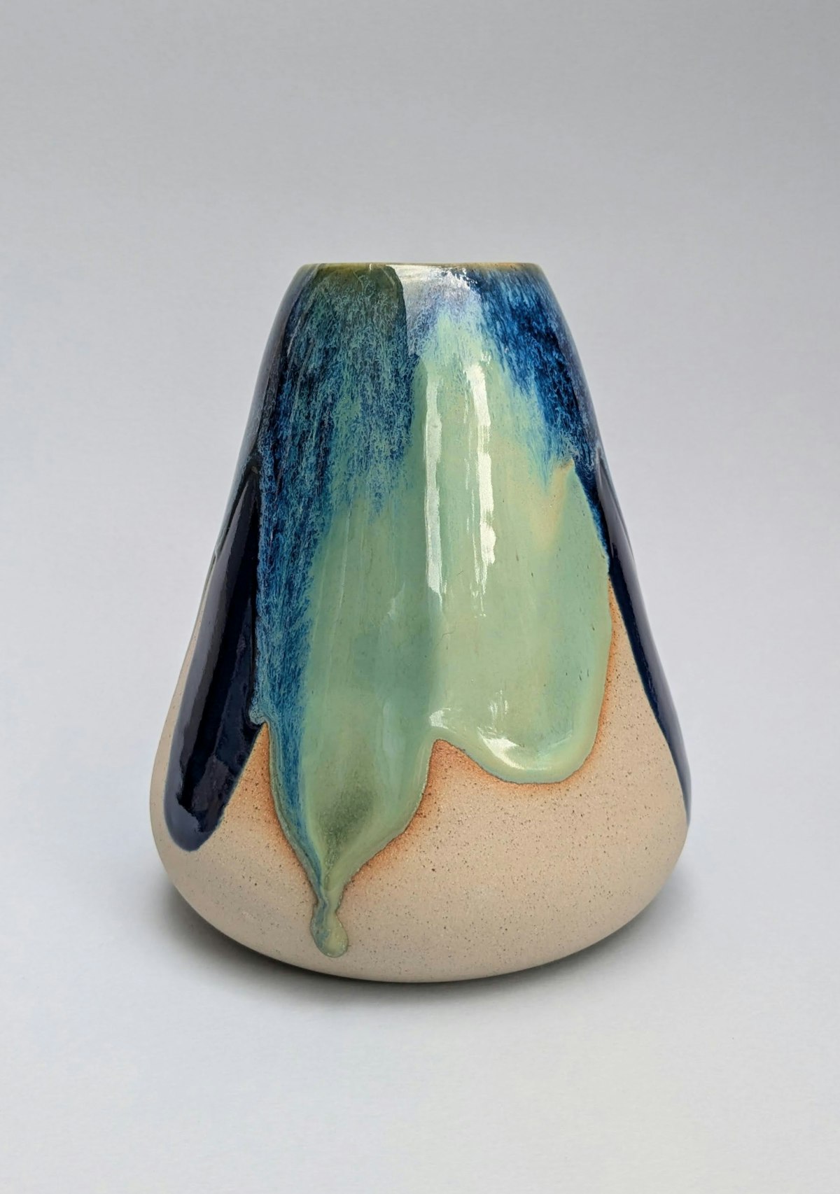A blue and green ceramic ornament