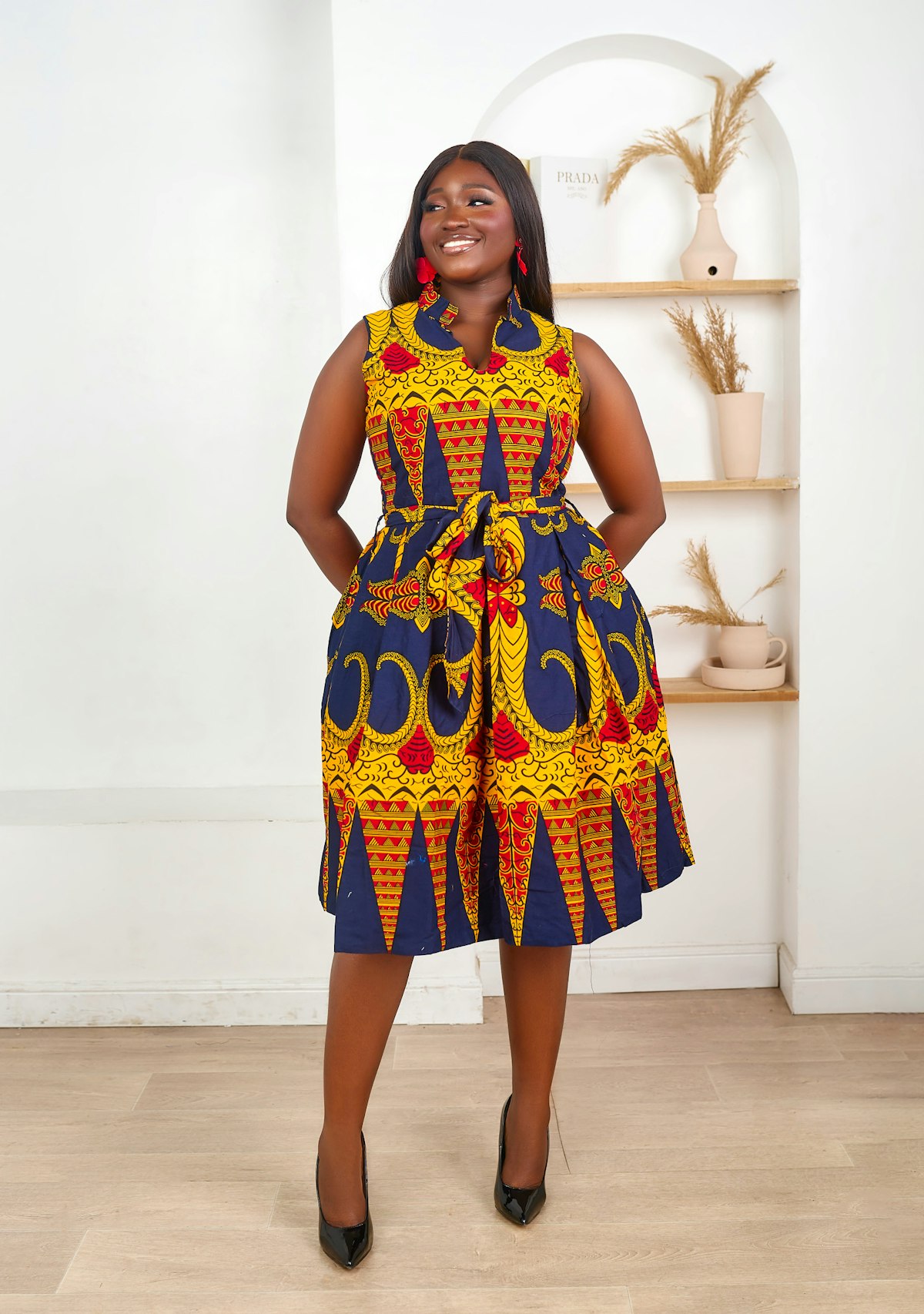 A lady wearing a brightly coloured dress