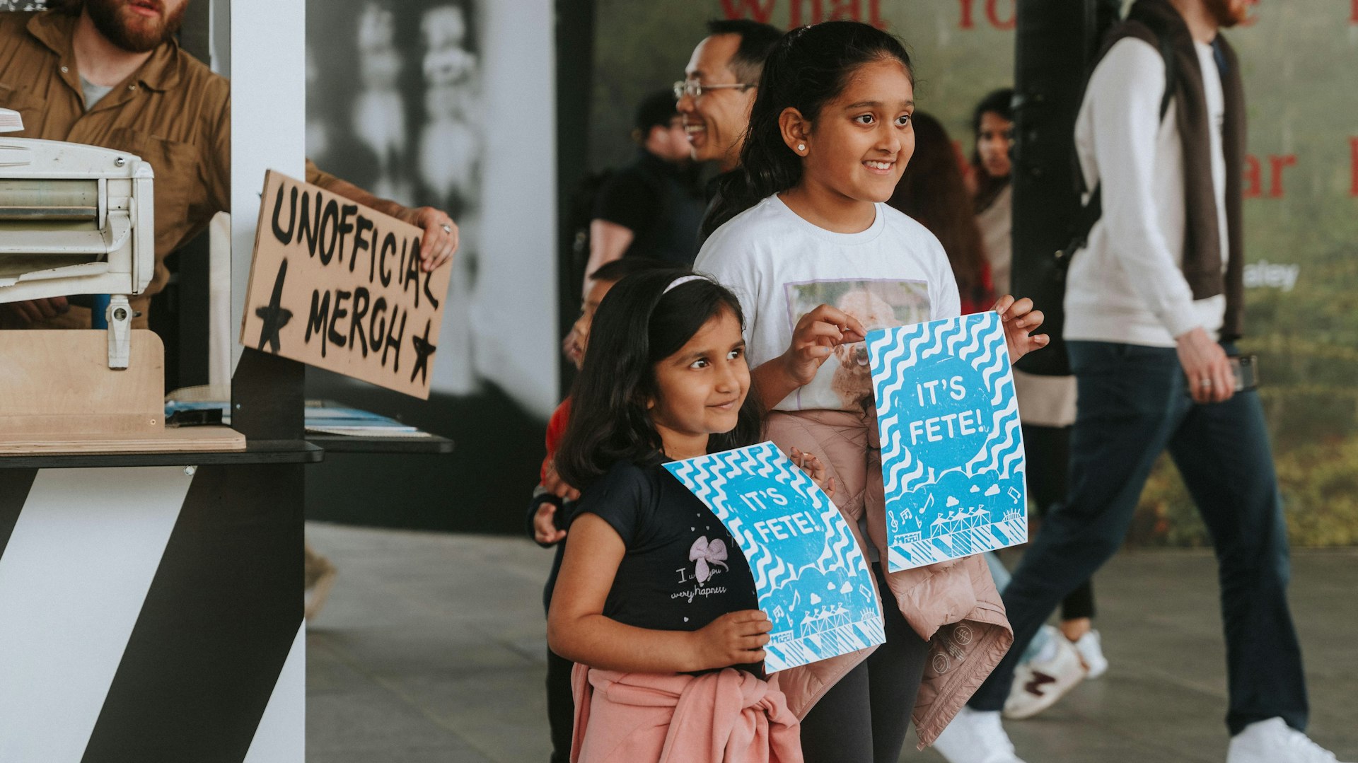 Two children holding their prints