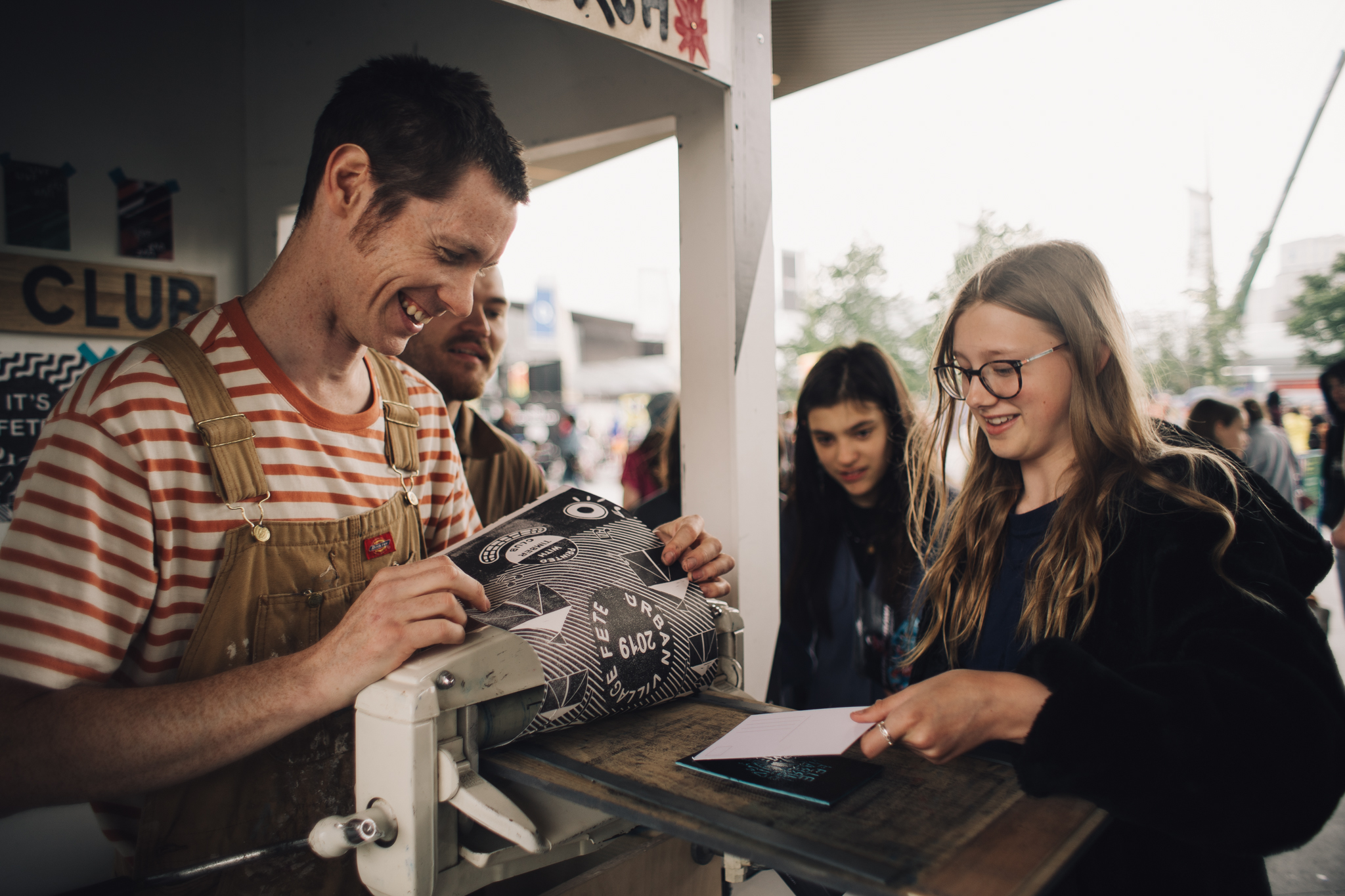 A man and woman make prints 
