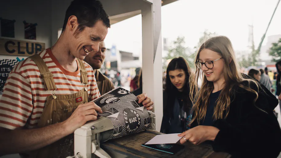 A man and woman make prints