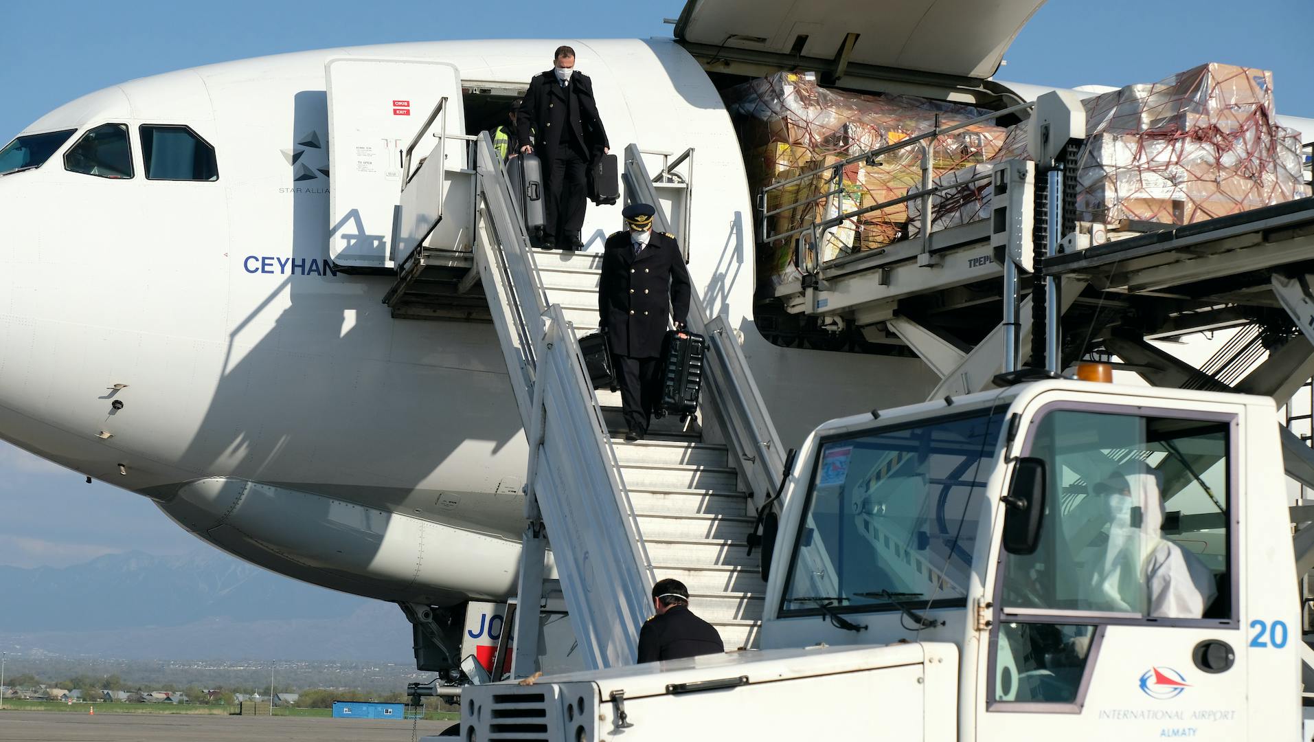 Staff remove humanitarian aid cargo from a privately chartered flight.