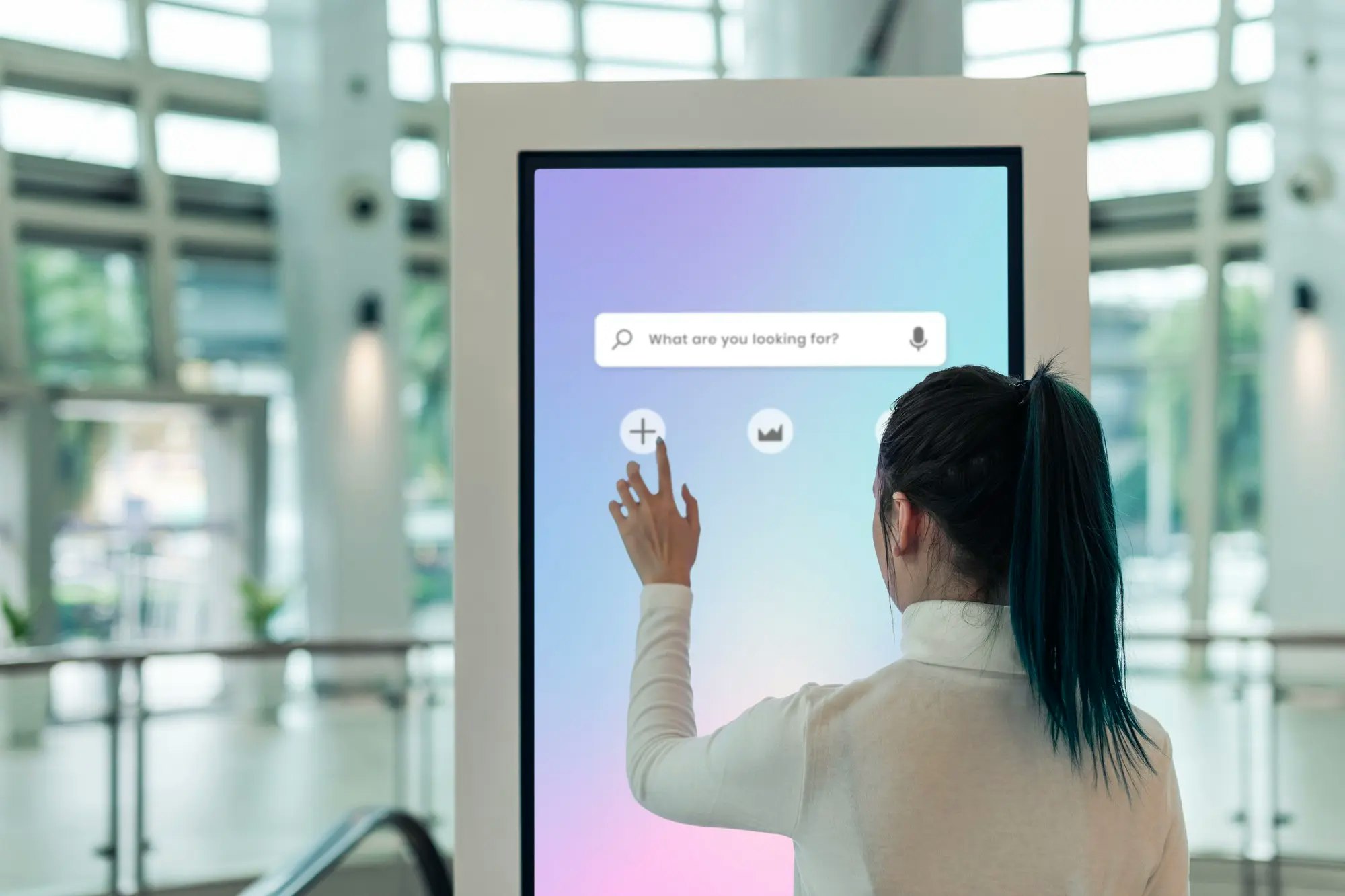 Woman Using Self-service Kiosk