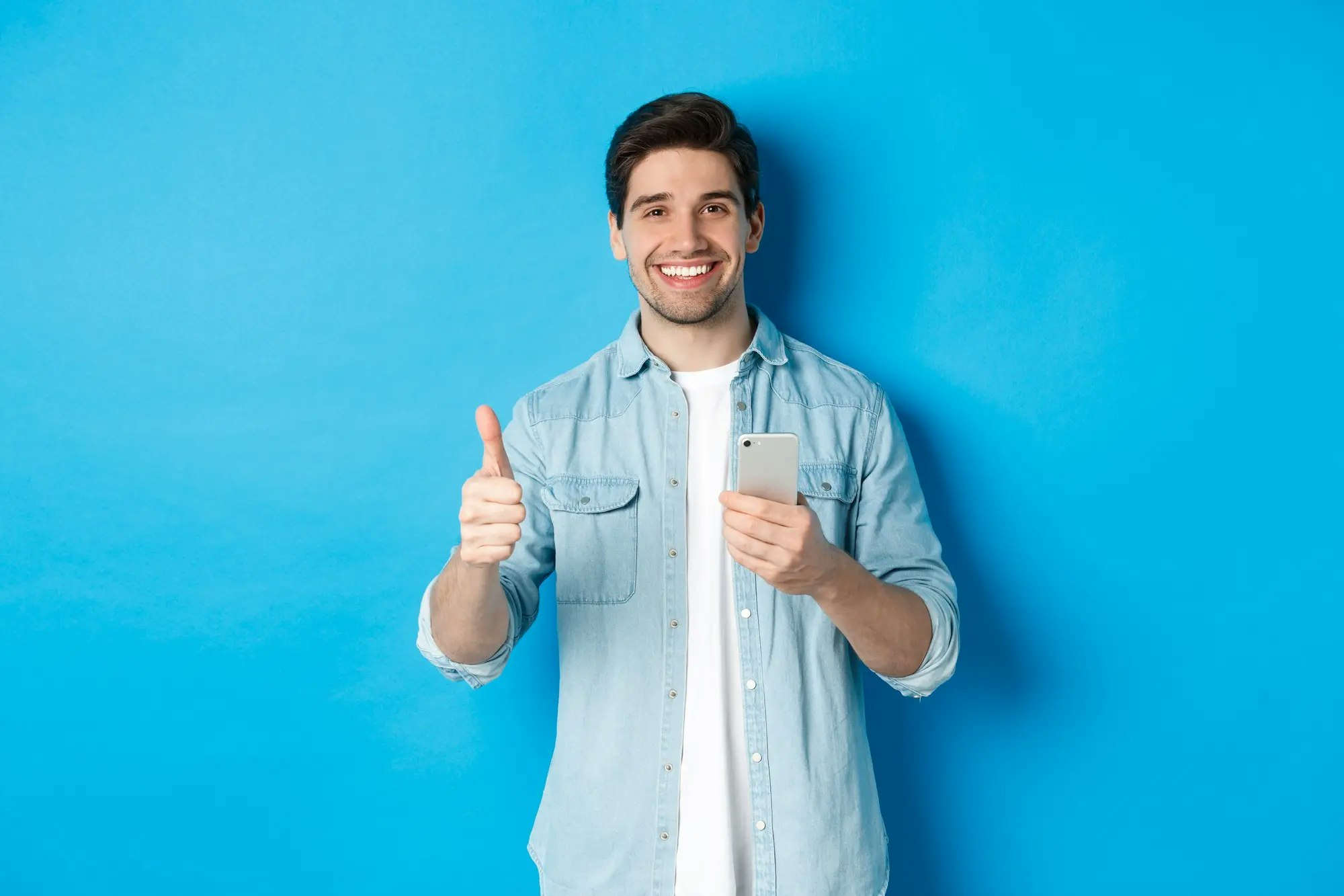Satisfied Man Smiling Showing Thumbs Up After Using Grub24 App - Online Shopping Applications Technology