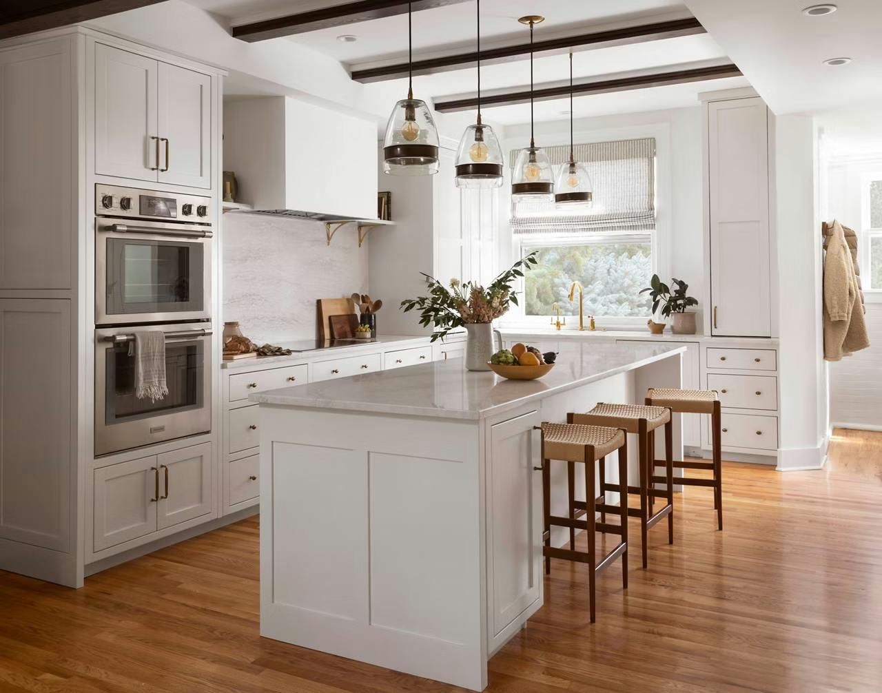 white modern kitchen with Ironsbridge white countertop and white wooden cabinet