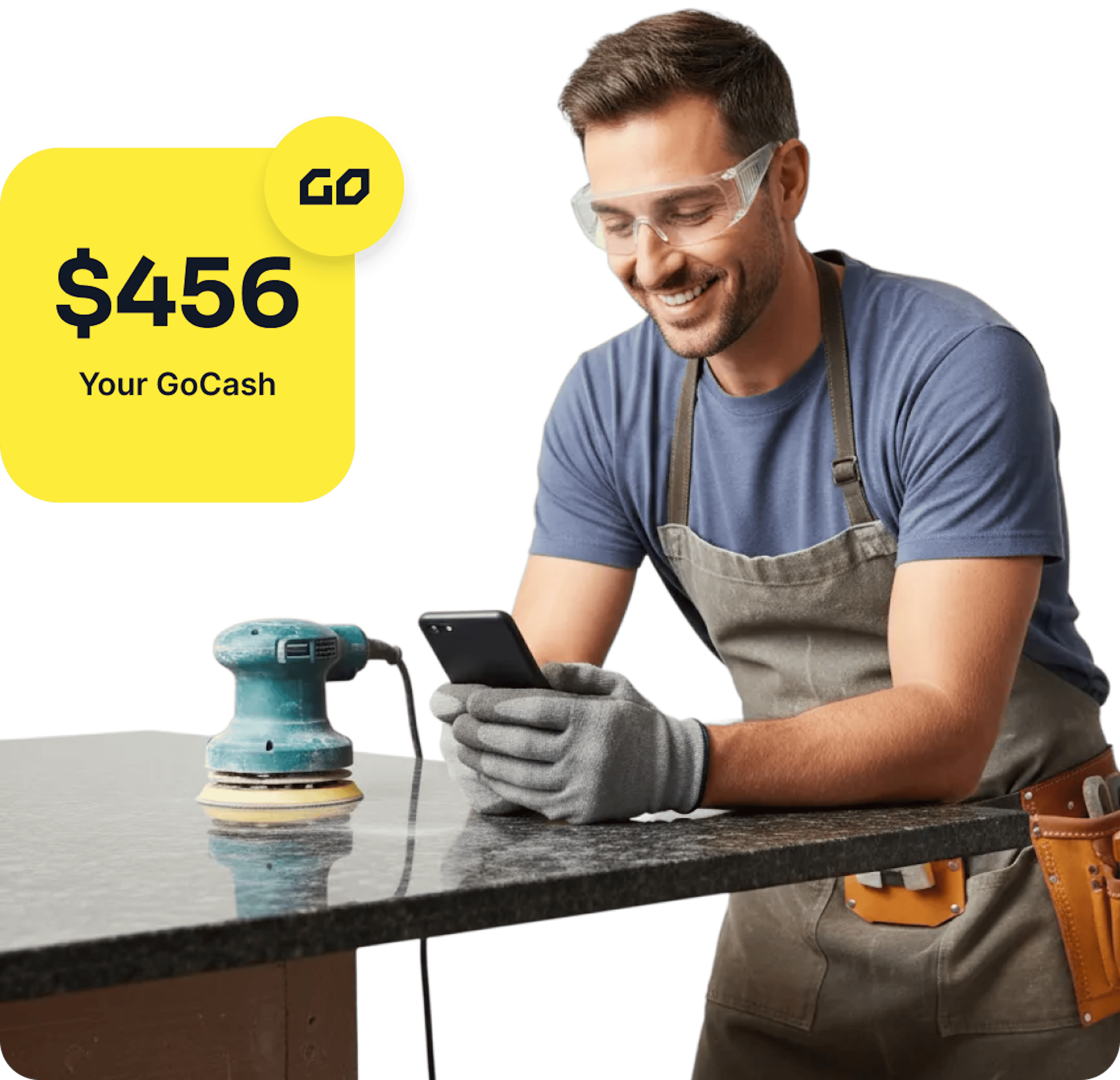 Stone fabricator looking at his mobile phone