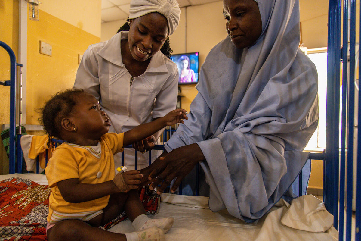 Baby with mother and nurse