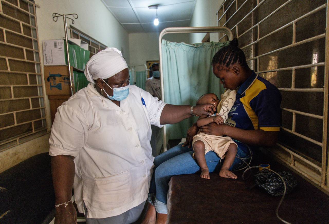 Nurse checking on child patient