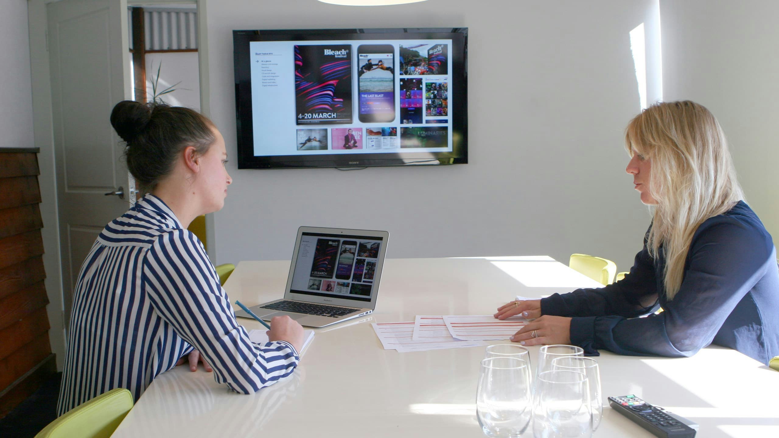 An intern girl doing a presentation to the managing director of Guerrilla