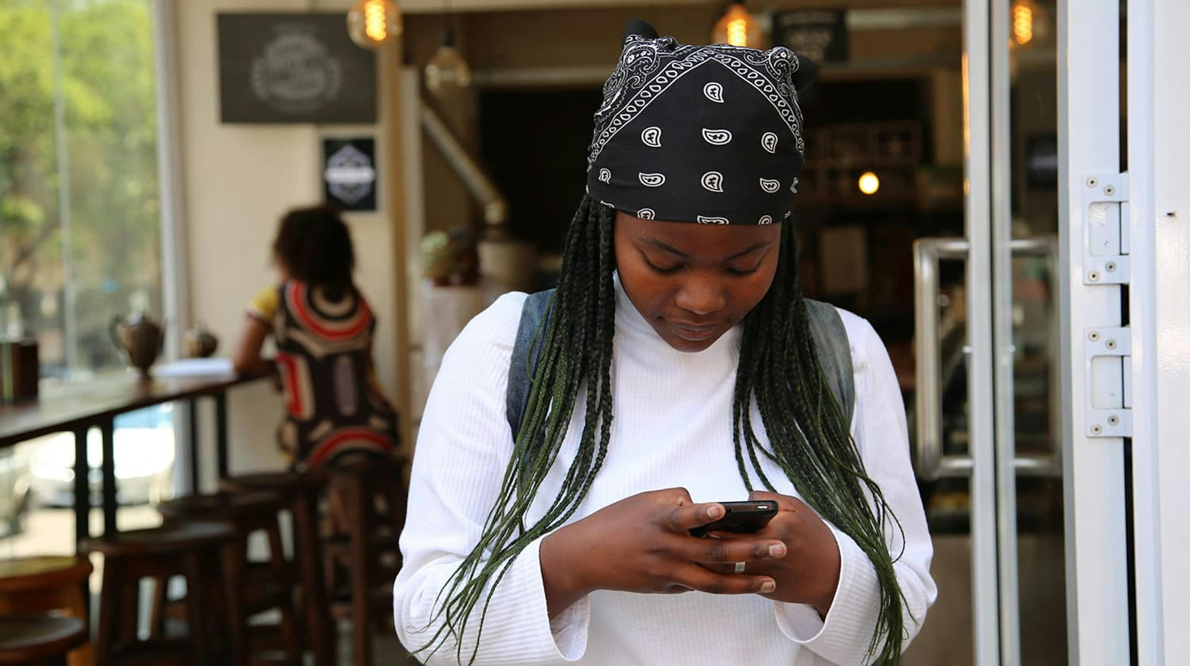 Woman creating content strategy on her phone