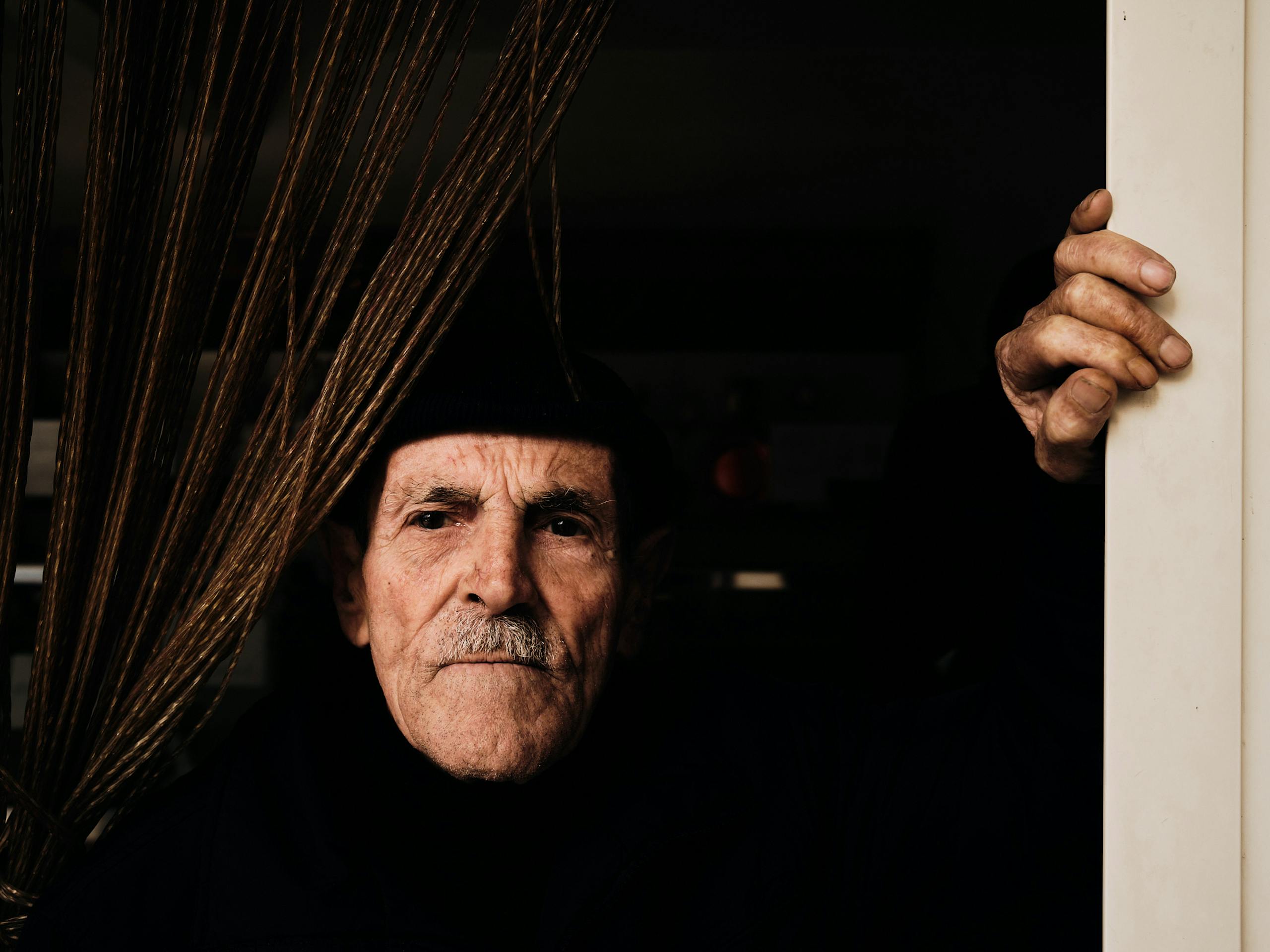 Residents at Panificio Rizzo at the Istituto Case Popolari, Milo Nuovo district, Sicily. December 2021