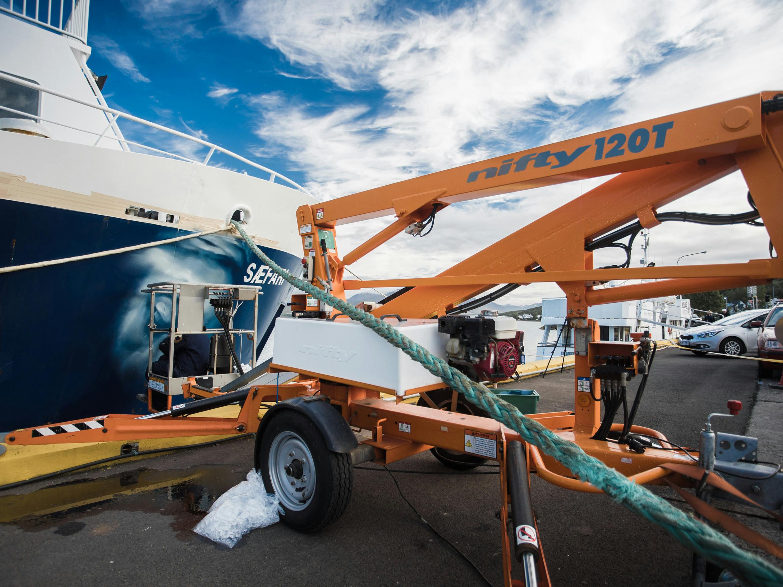 Painting in Akureyri Harbour Iceland. August 2015 Photograph: Selina Miles