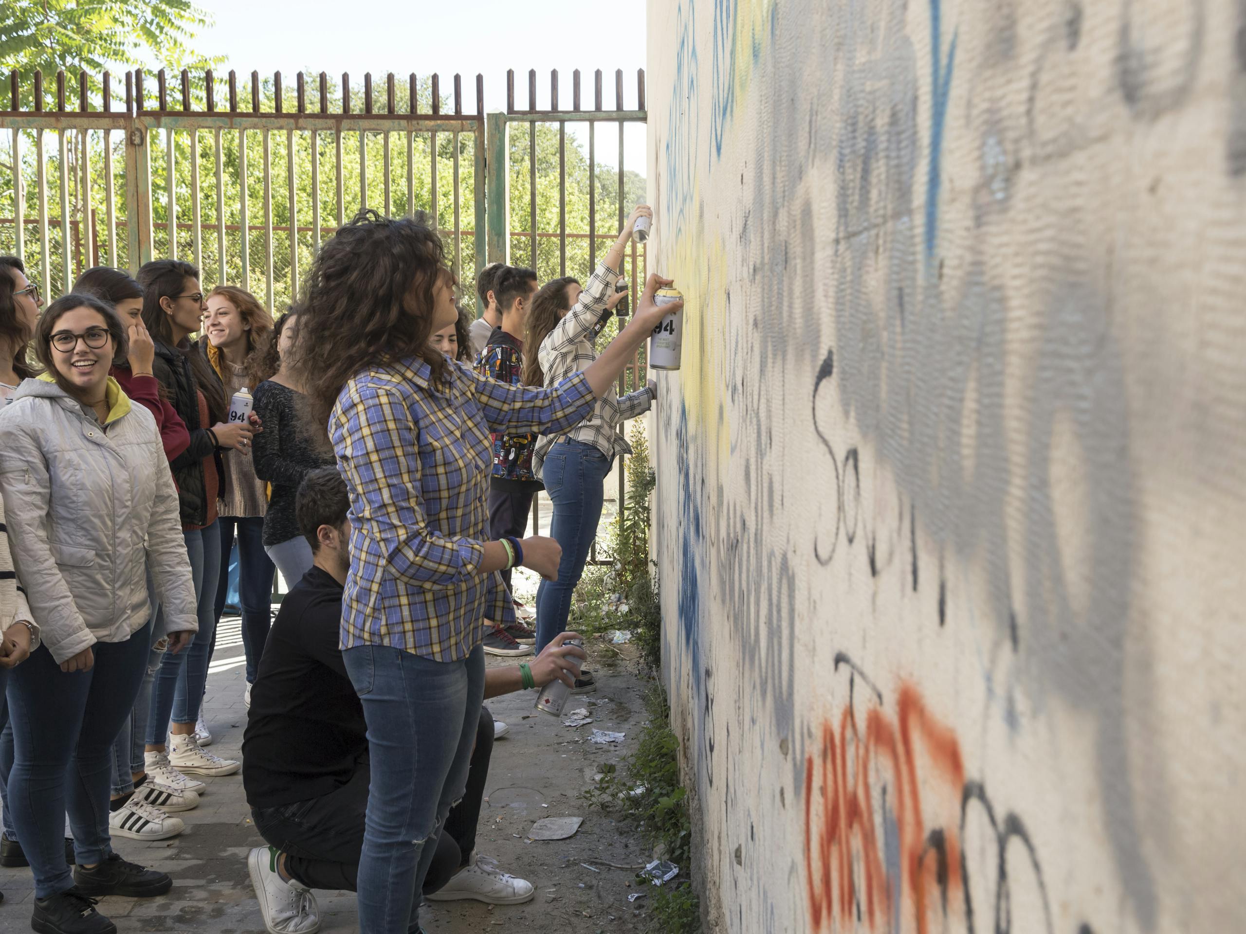 Guido van Helten and Vincenzo Cascone direct Liceo Umberto Classico I - addition to the Marsala. Ragusa, Sicily, Italy. October 2017 Photograph: Marcello Bocchieri