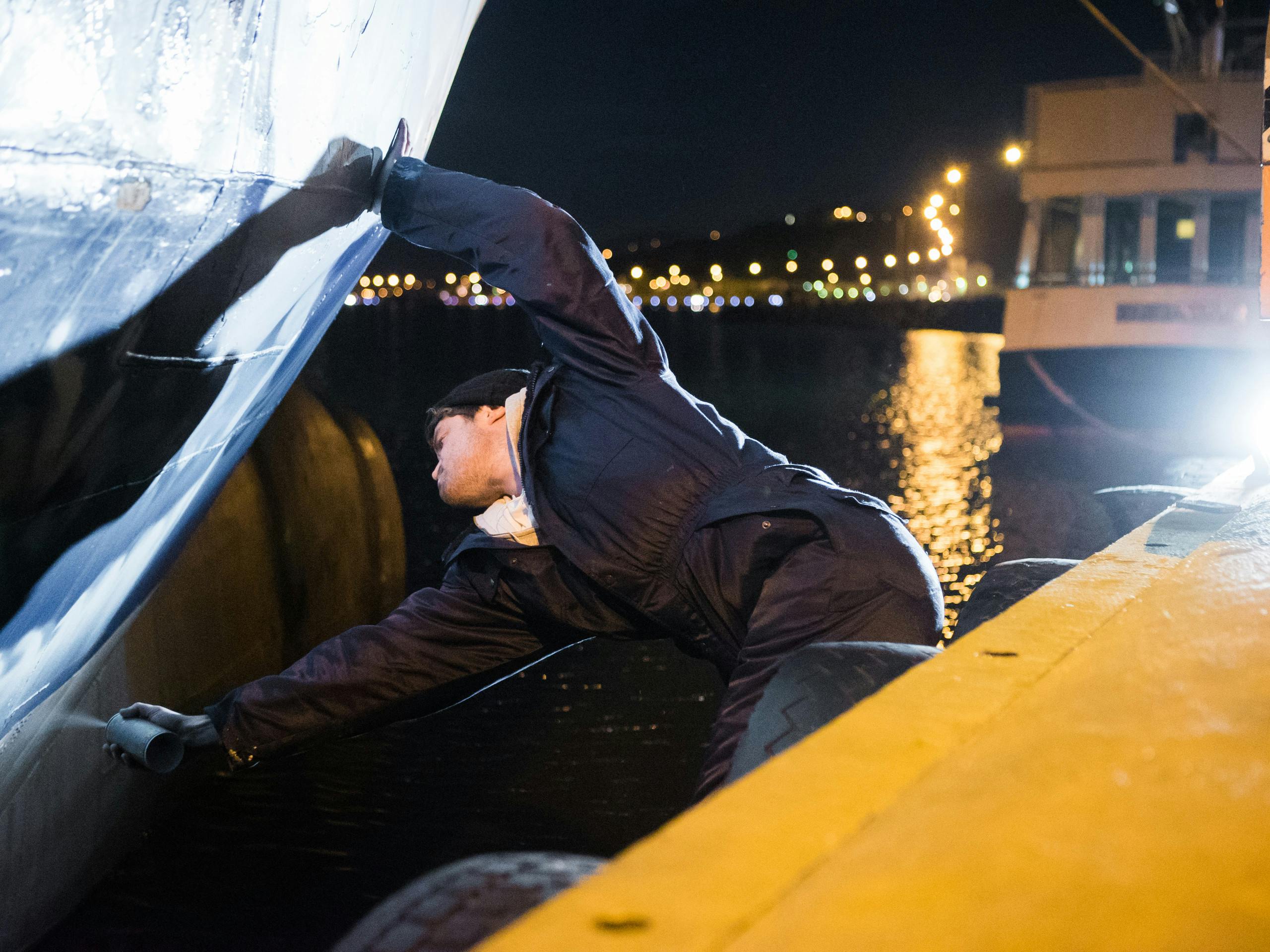 Late nights painting the Saefari Ferry in Akureyri Harbour Iceland. August 2015 Photograph: Selina Miles