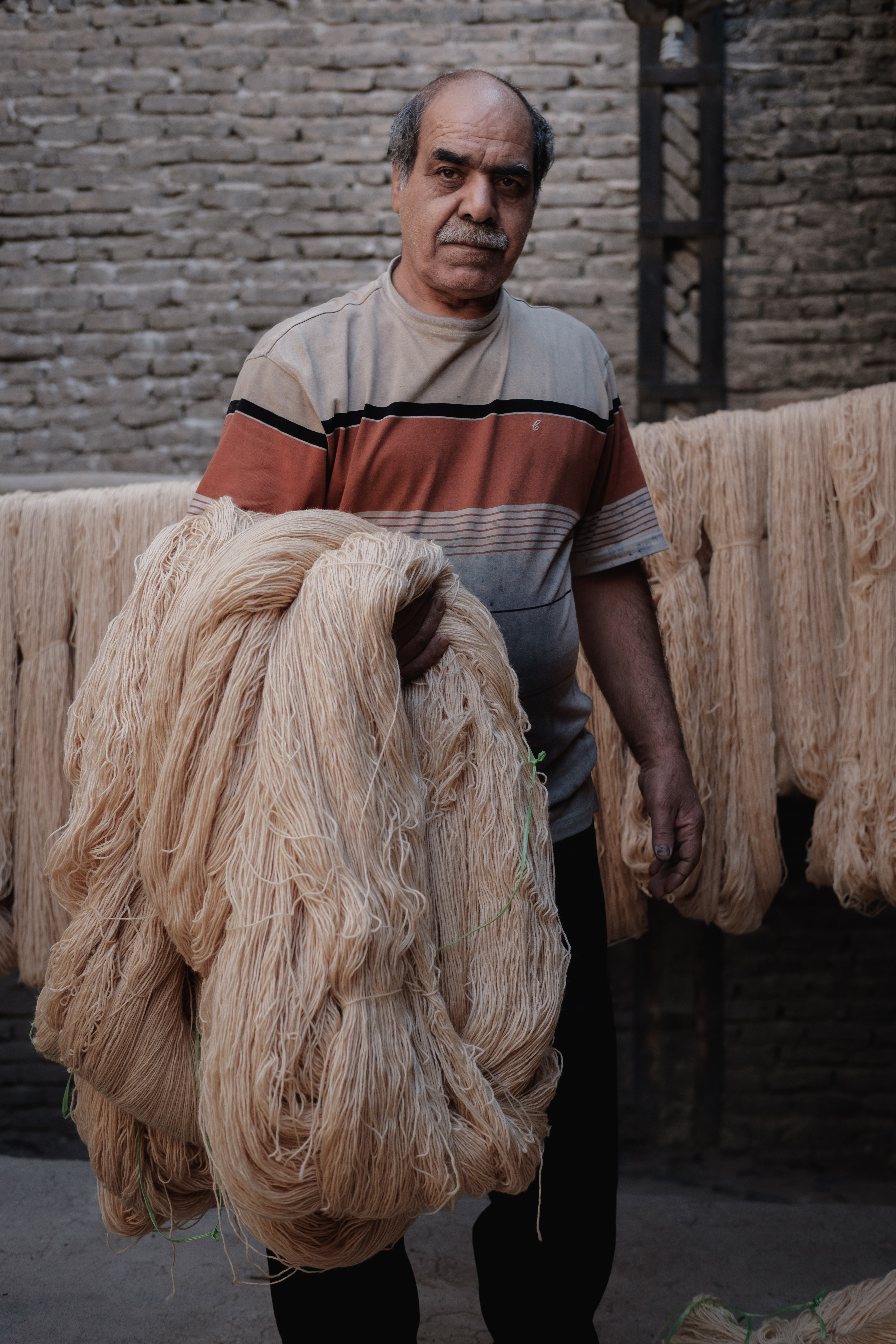 Drying the Wool following the dying process Kashan, Iran. November 2018 Photograph: Guido van Helten