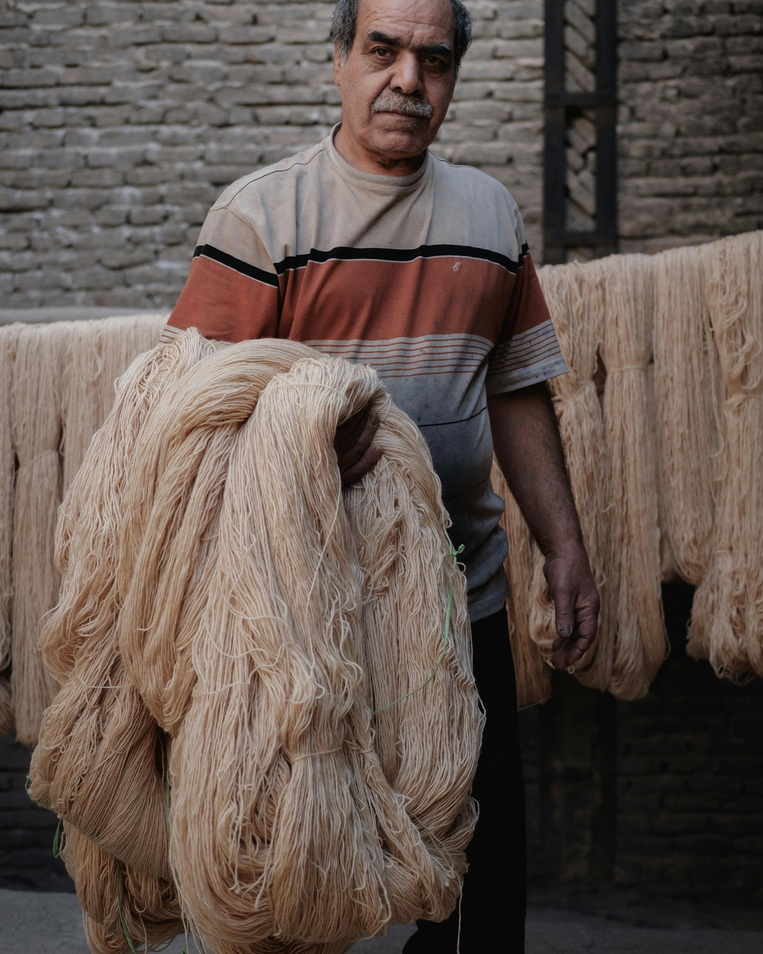 Drying the Wool following the dying process Kashan, Iran. November 2018 Photograph: Guido van Helten