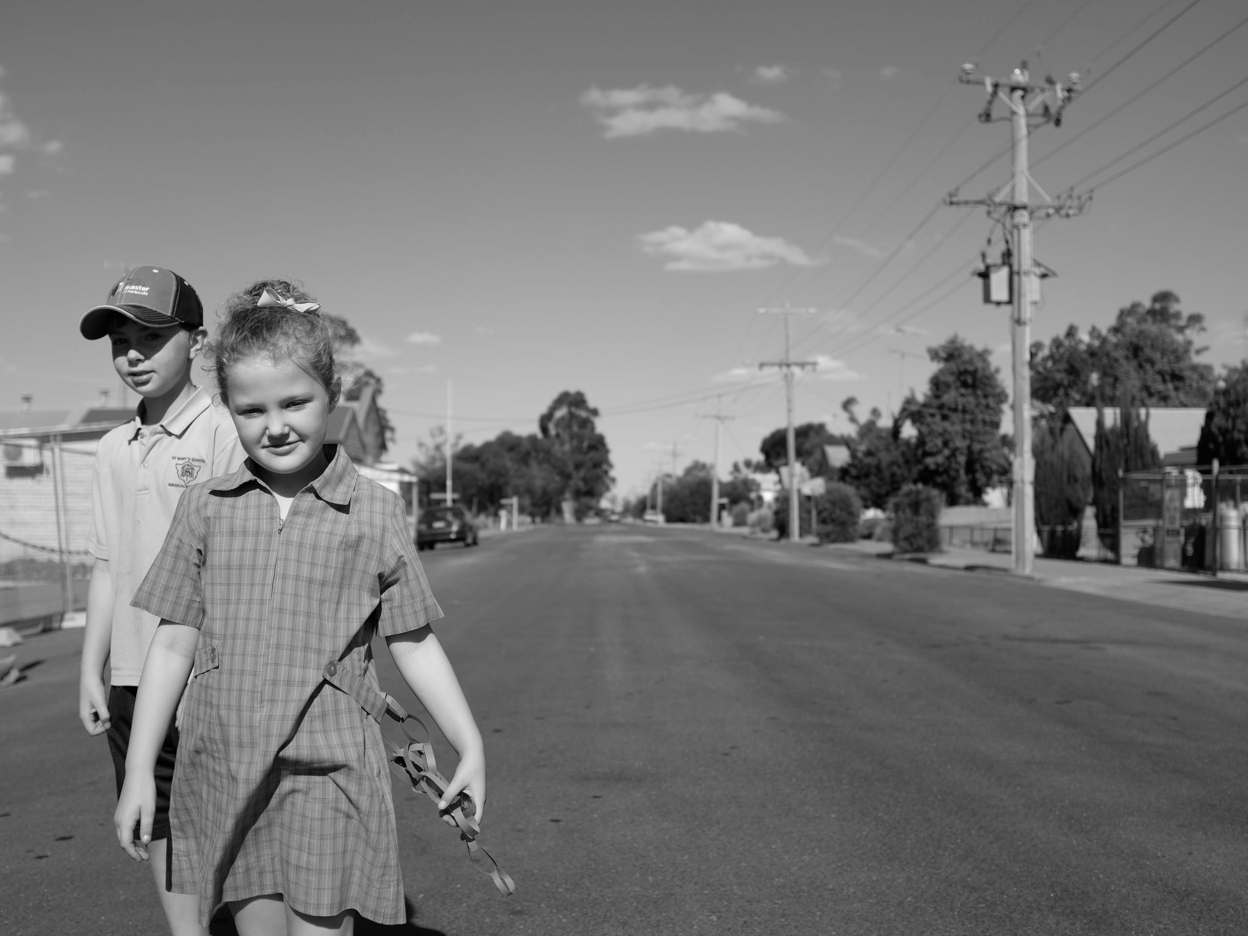 Local Children in Main street, Brim, Victoria, Australia. December 2015. Photograph: Guido van Helten