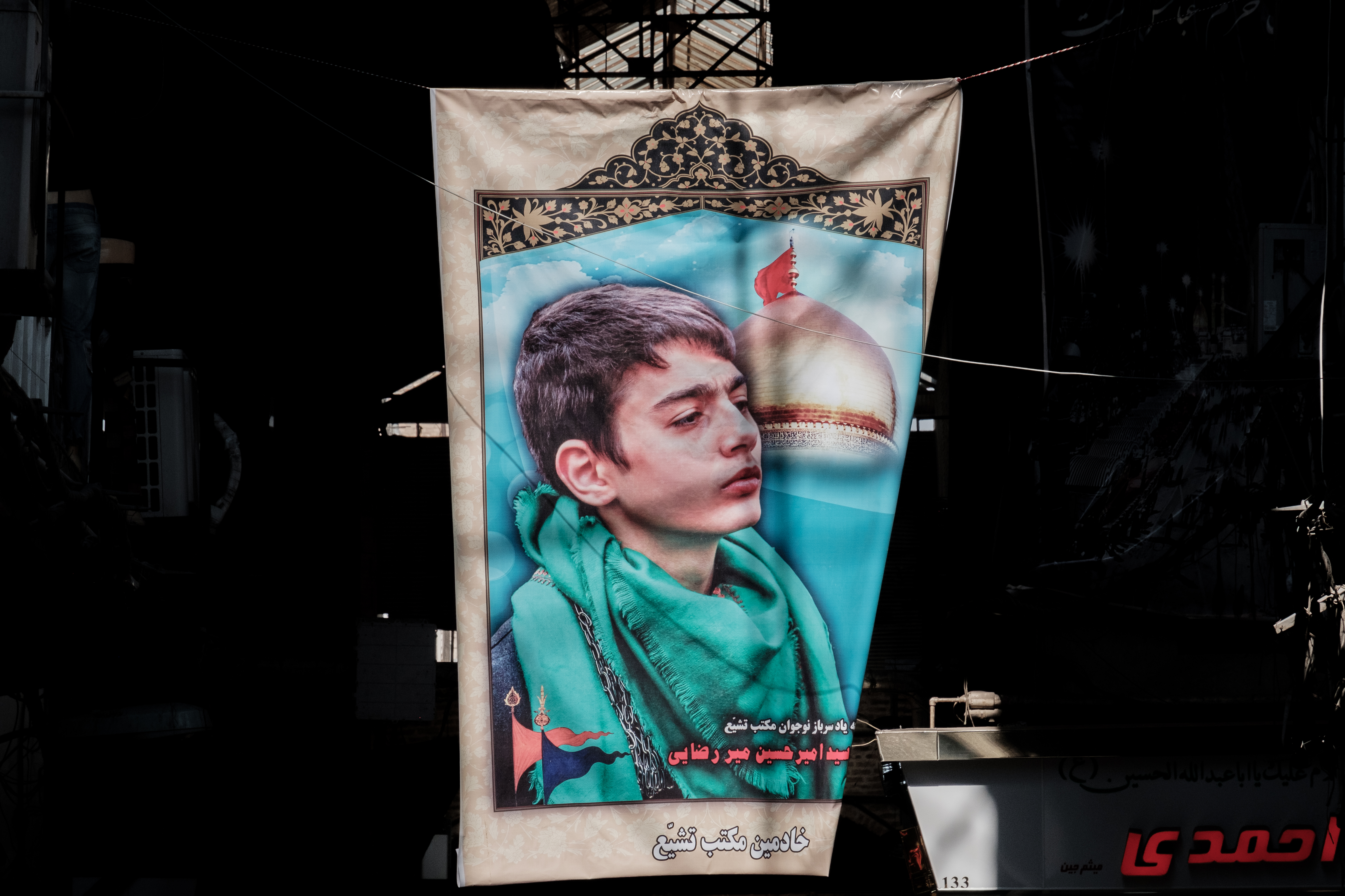 A poster for a fallen Martyr in Tehran's central Bazaar Tehran, Iran. November 2018 Photograph: Guido van Helten