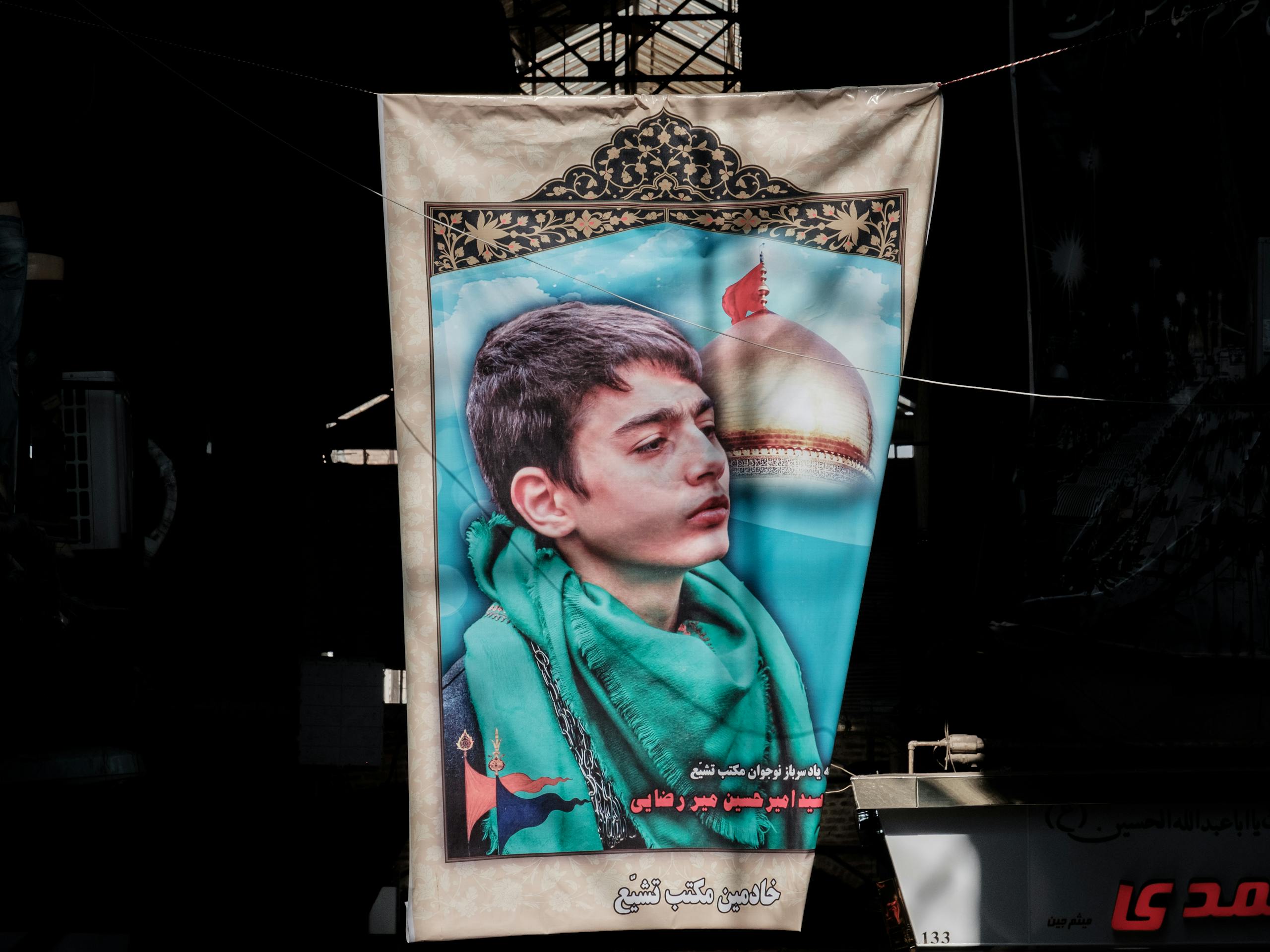 A poster for a fallen Martyr in Tehran's central Bazaar Tehran, Iran. November 2018 Photograph: Guido van Helten