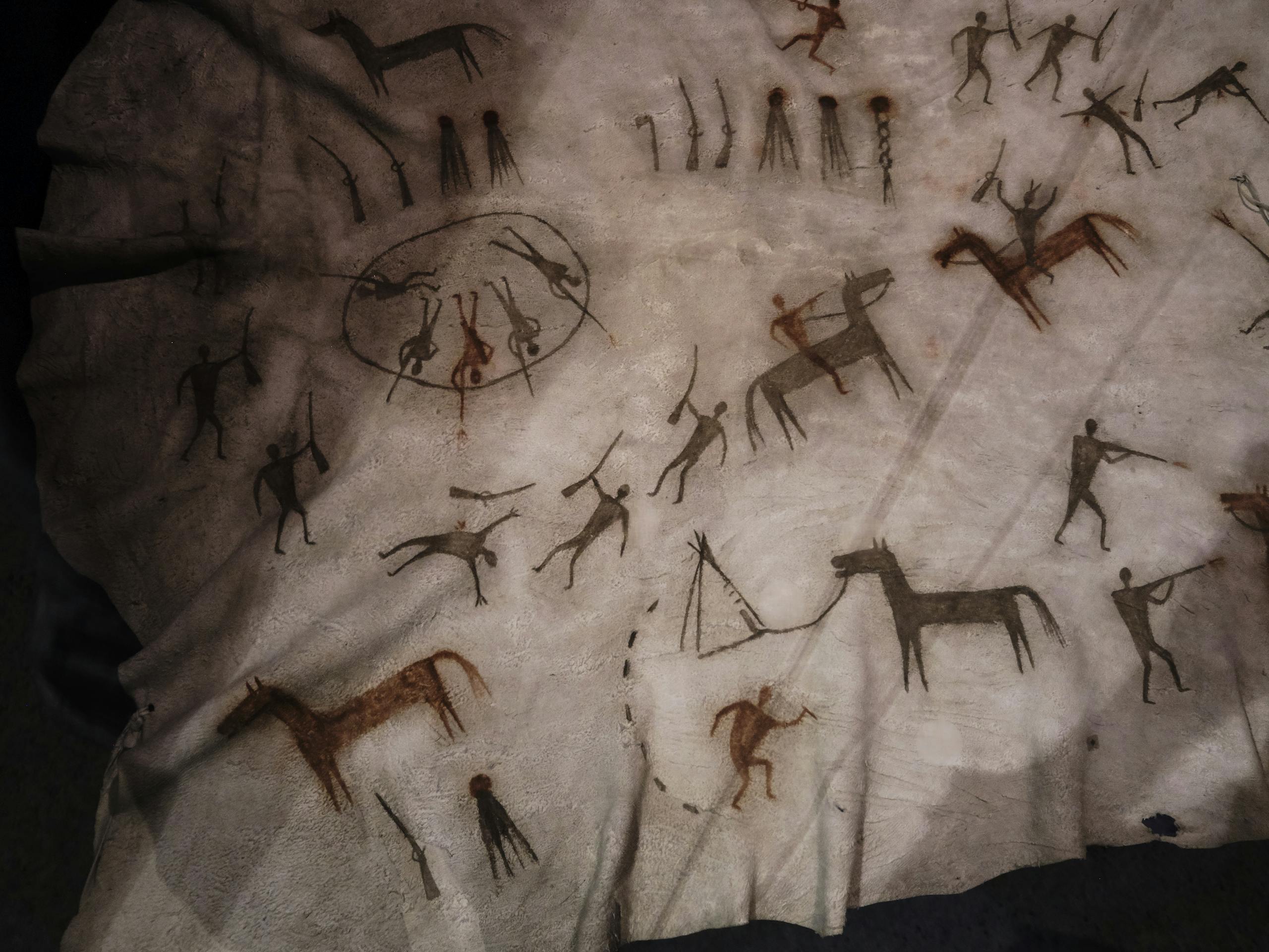 Raw Eater's Story Robe, Siksika, late 1800s, depicting battles with Cree enemies on elk hide - Glenbow Museum Calgary, Alberta, Canada. September 2019 Photograph: Guido van Helten
