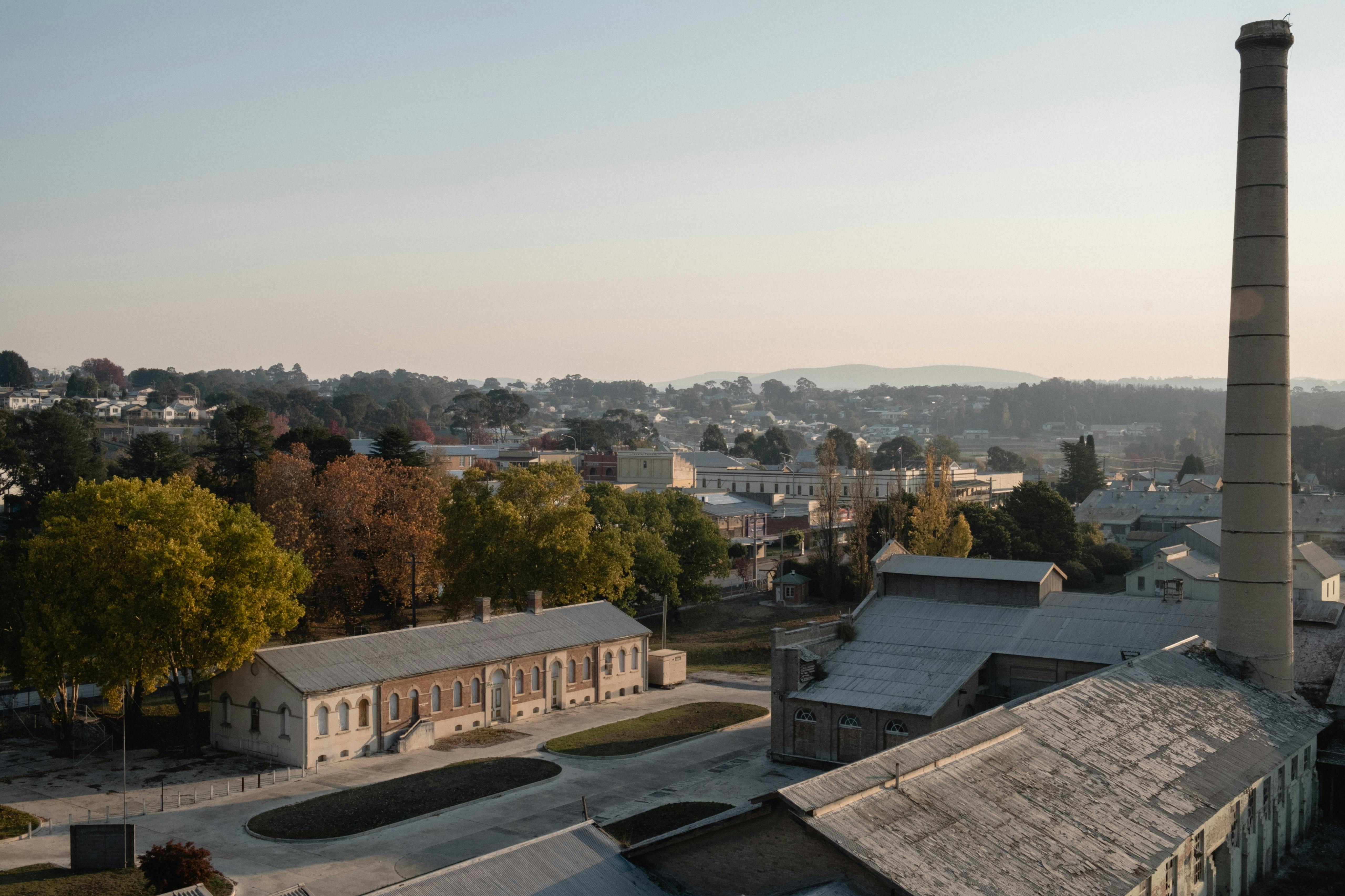 View looking west over the roofs of the old Cement Works towards the centre of town Portland, NSW, Australia. May 2018 Photographs: Guido van Helten
