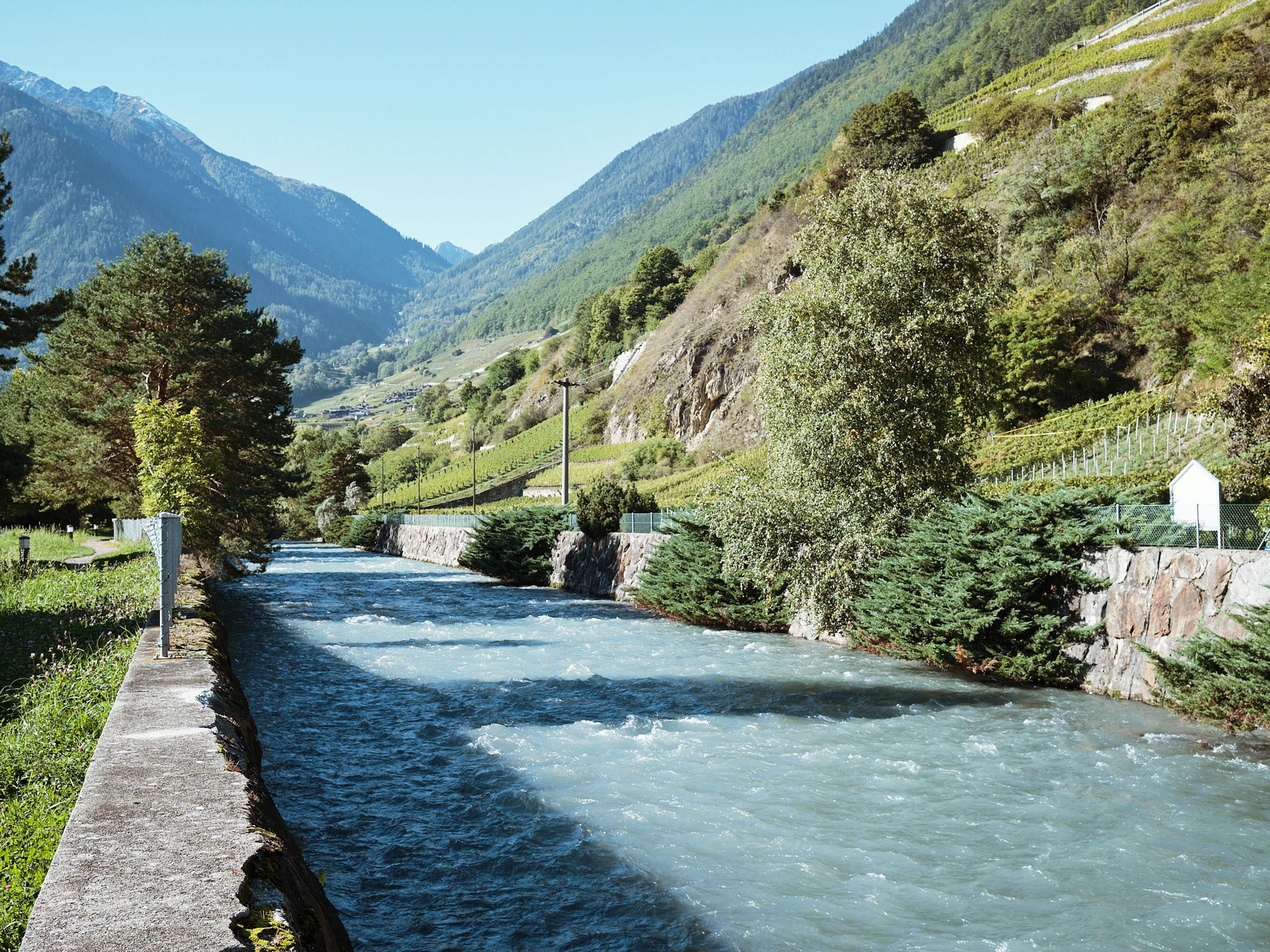 The Rhône flowing through centre of the city, Martigny, Switzerland. October 2021
