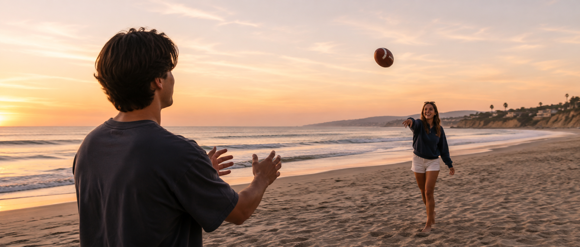 playing football on the beach