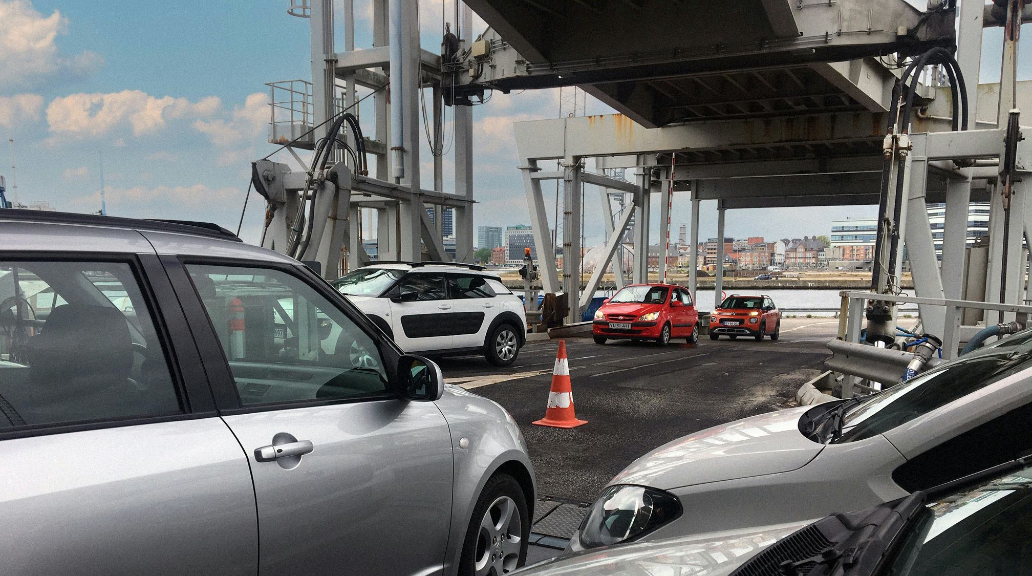 Cars boarding a ship