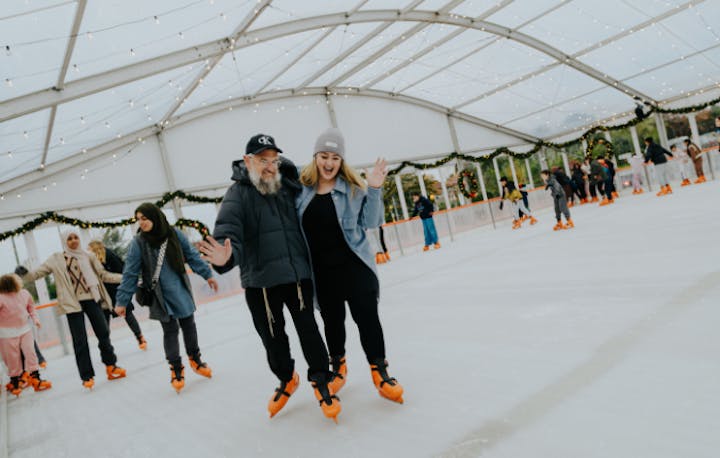 A couple enjoying the ice rink at Brent Cross