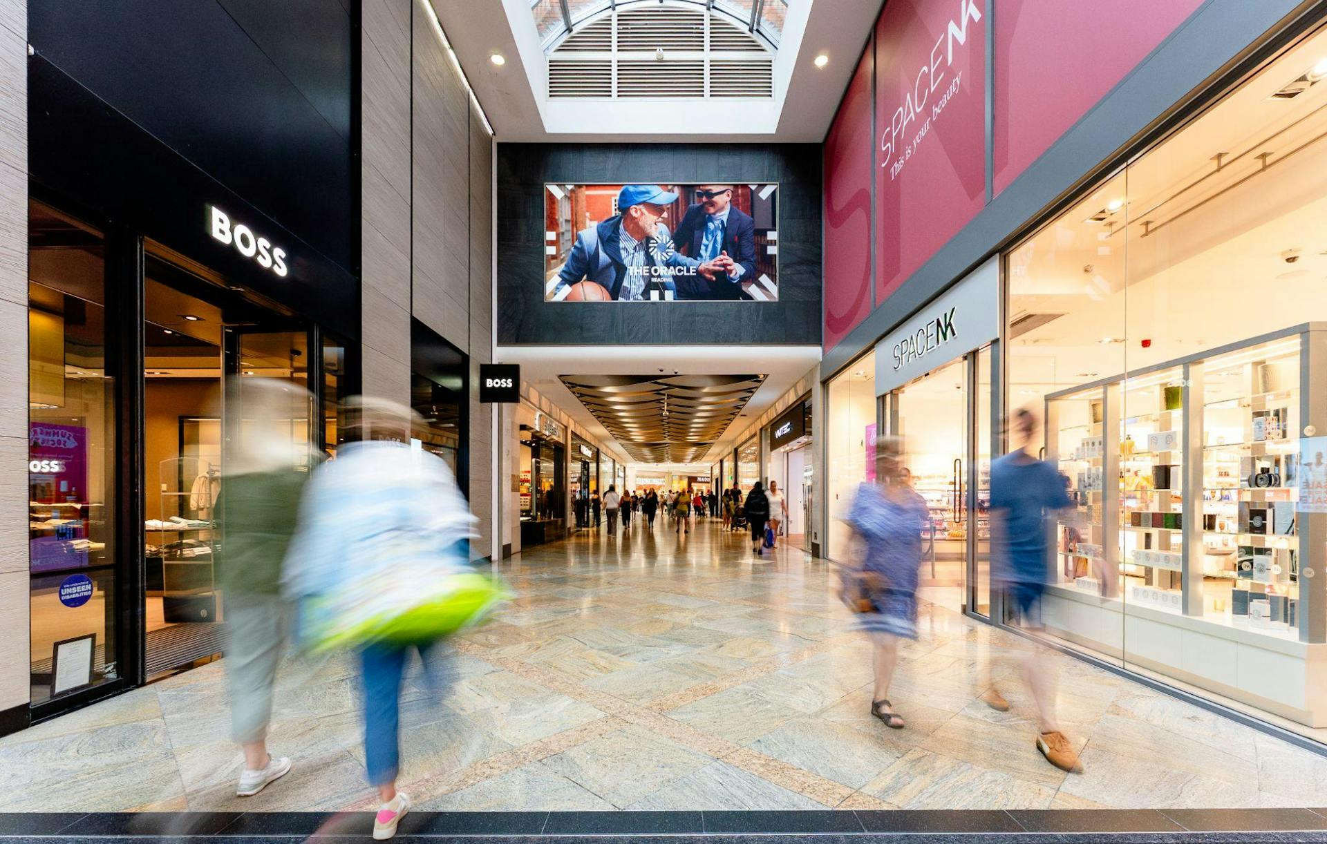 People walking through The Oracle