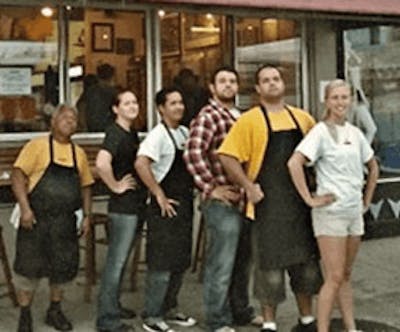 Hank's Haute Dogs employees in front of old location
