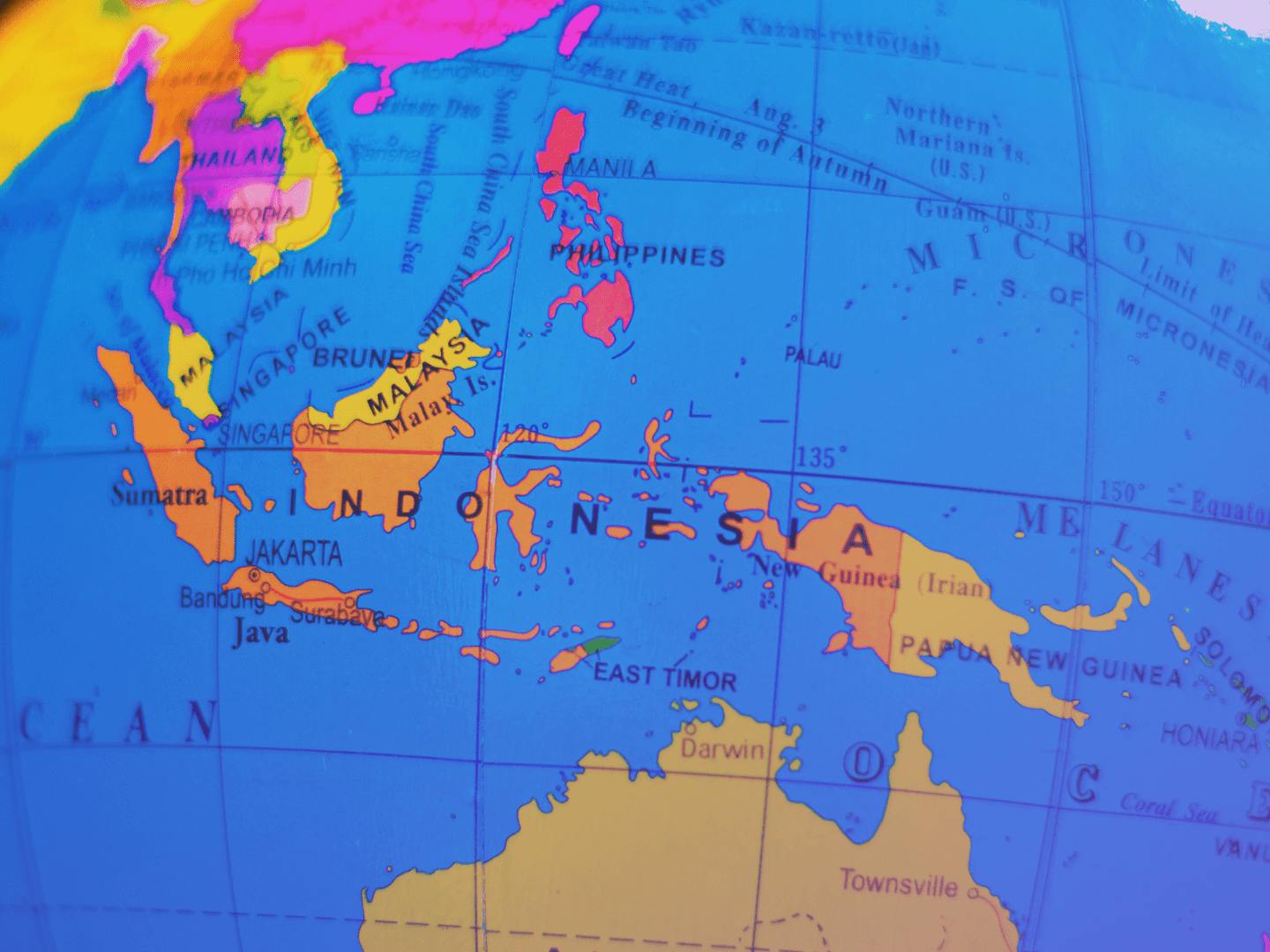 A close-up of a globe highlighting Indonesia.