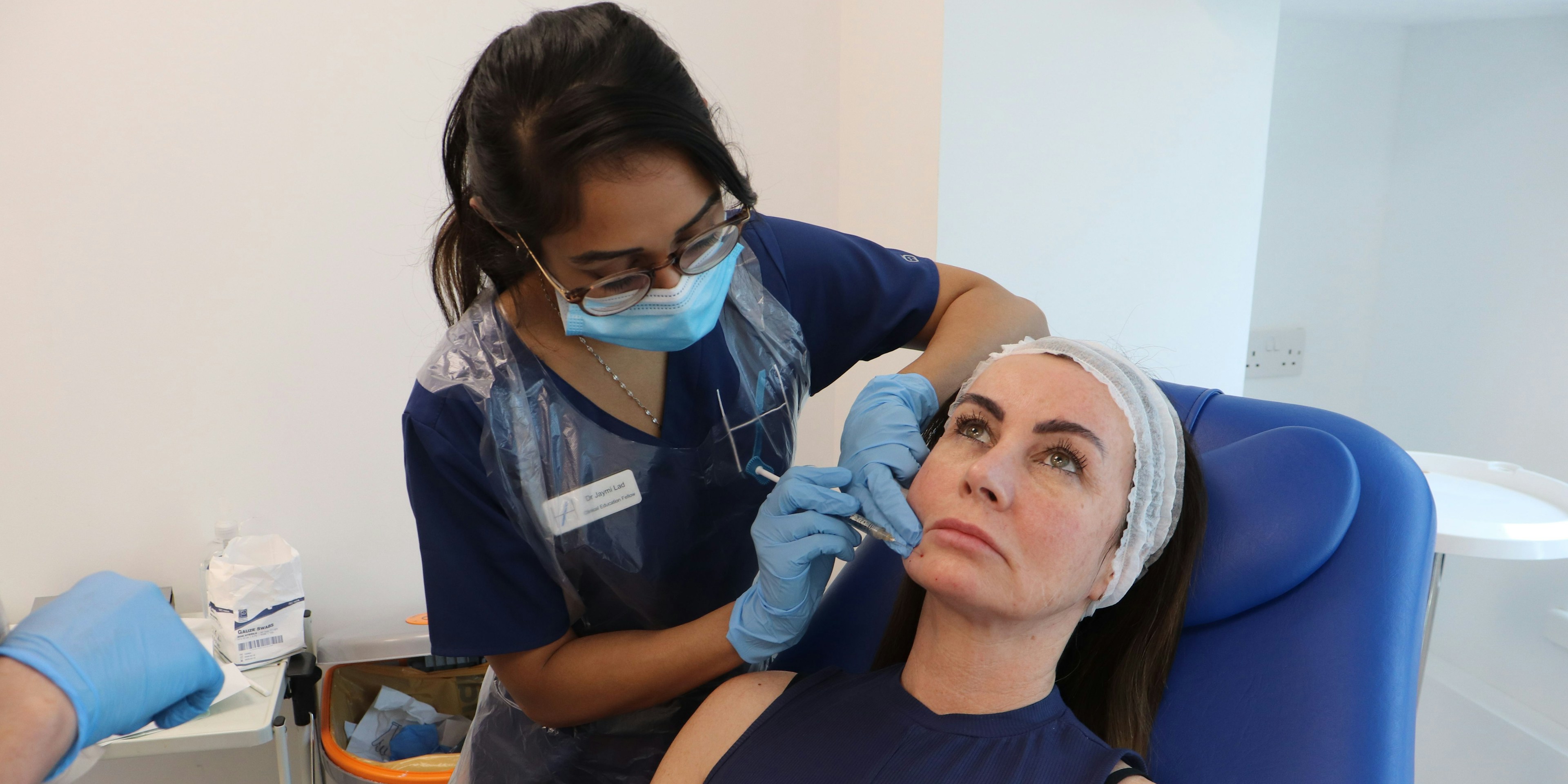 A patient receiving chin filler treatment