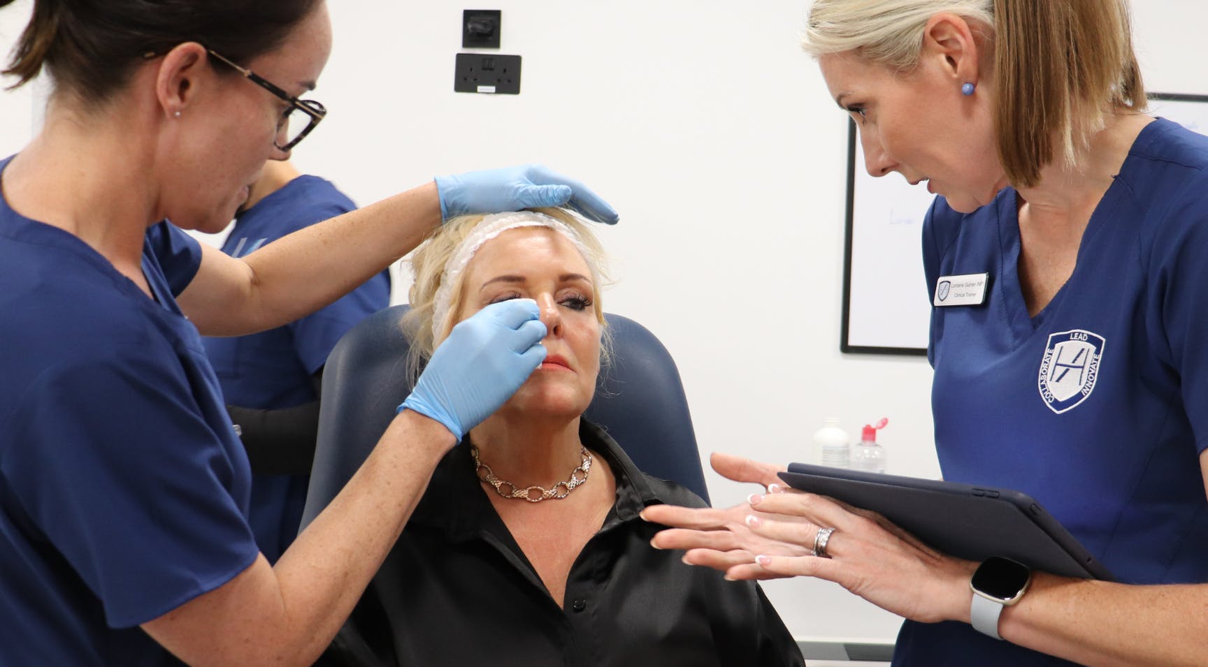 aesthetic nurses treating a dermal filler patient