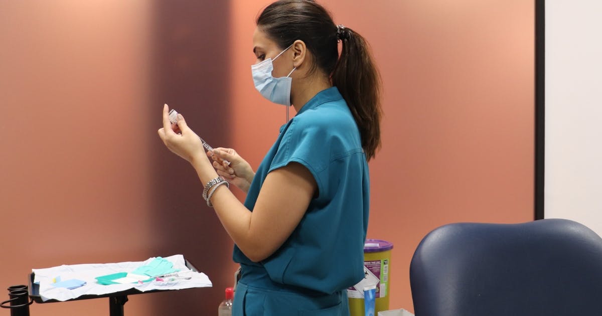 Harley Academy medical aesthetics course trainee drawing up botox