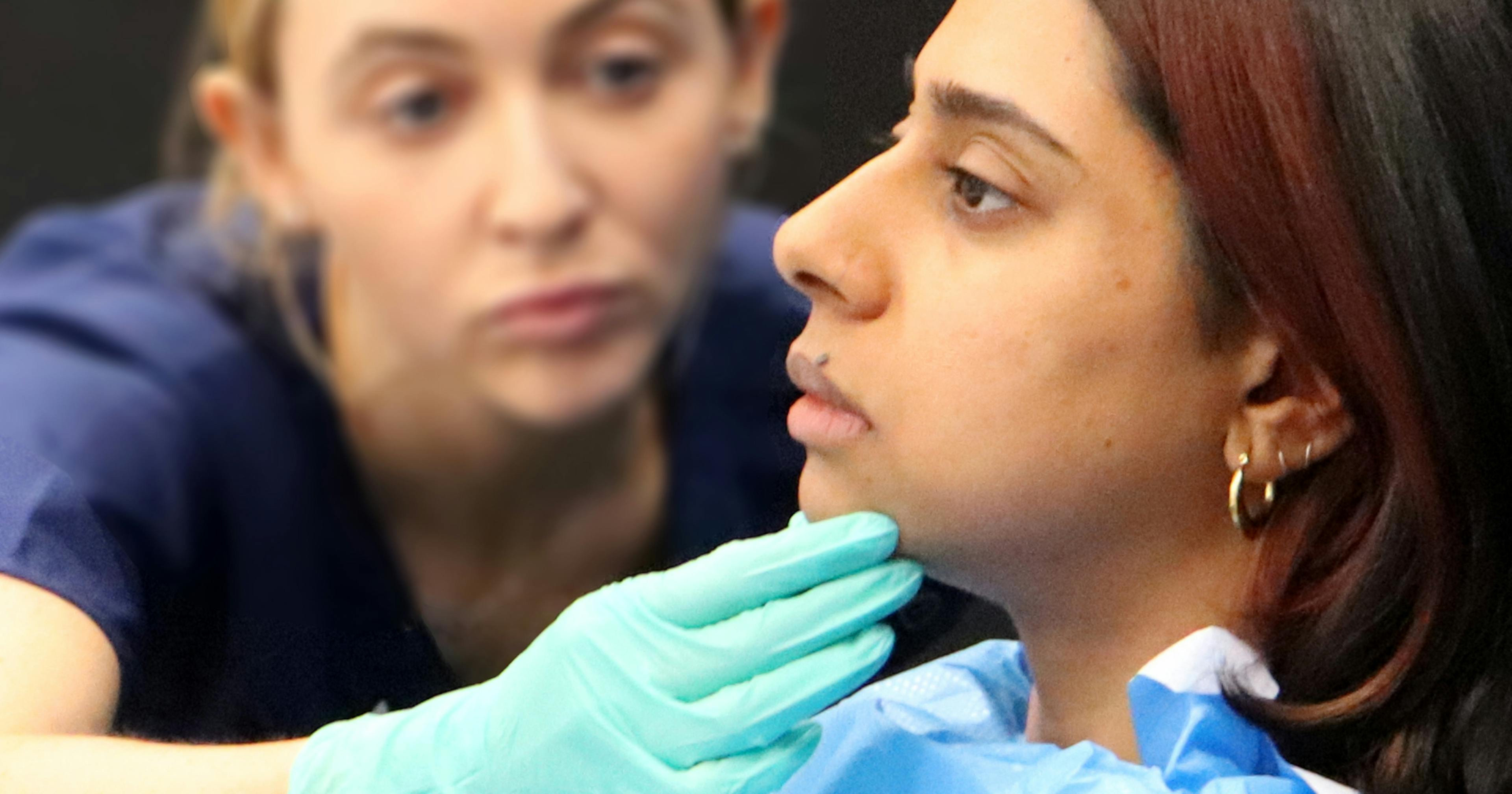 Facial assessment for chin filler injection technique demonstration at Harley Academy