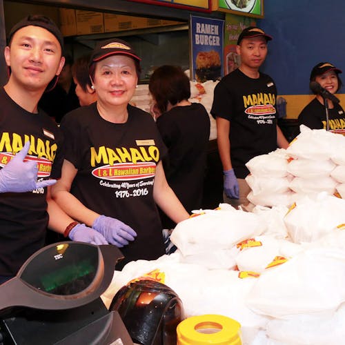 L&L volunteers smiling with shaka