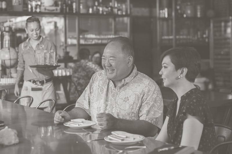 group of business people laughing at restaurant