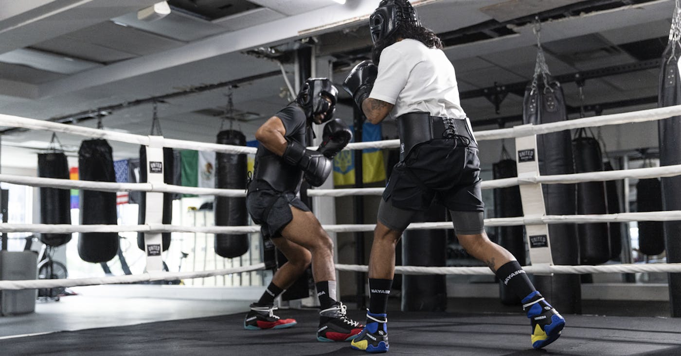 Boxing shoes with anchored traction for stability and agility