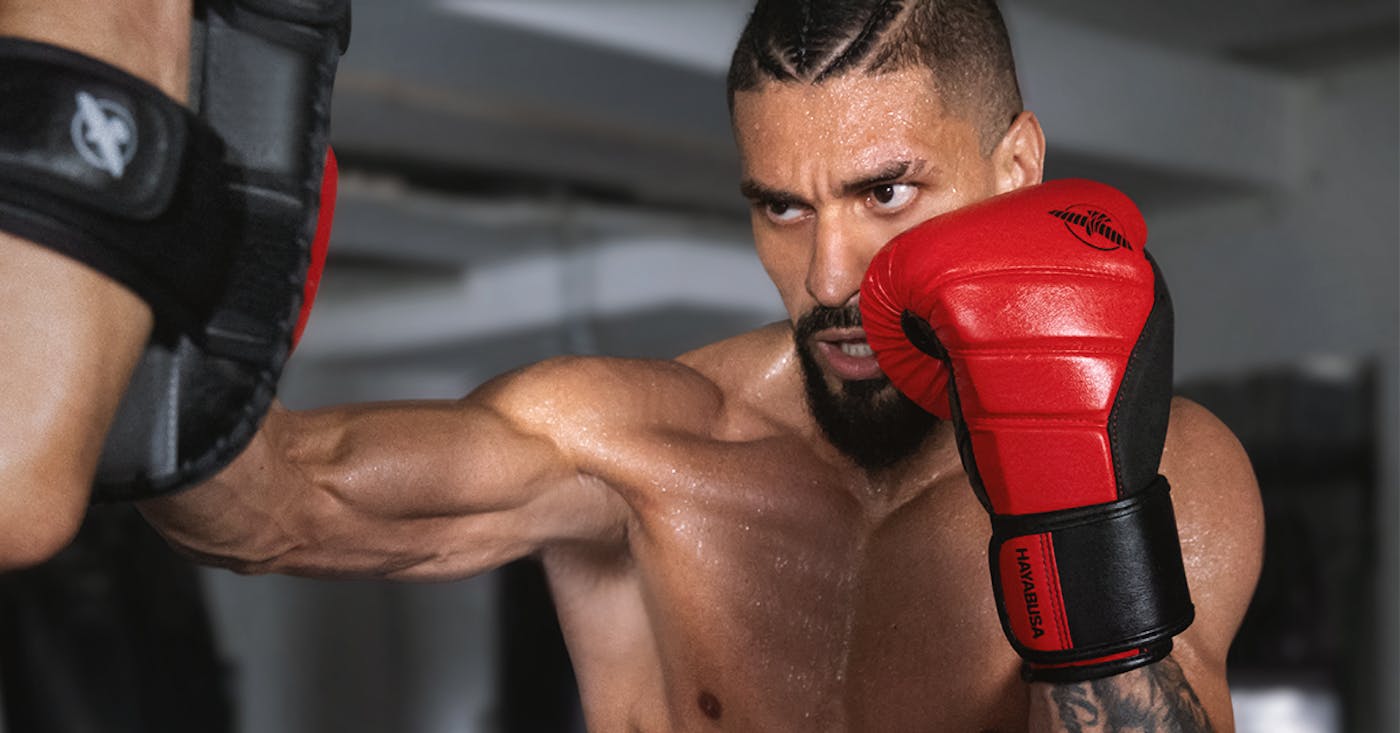 Shadow boxing with Hayabusa boxing gloves while focusing on technique and strength
