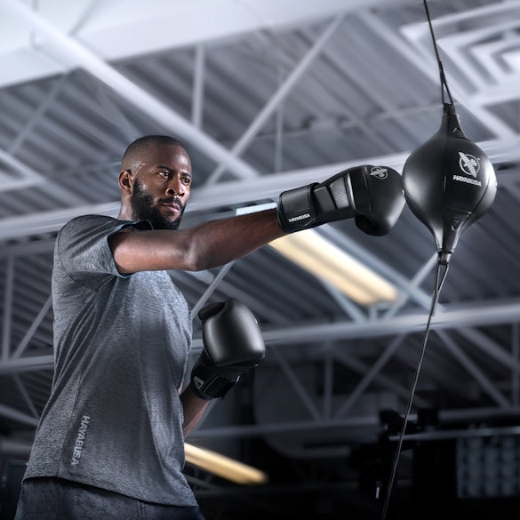 Double End Bag - Action shot with person hitting the Double End Bag with the right arm