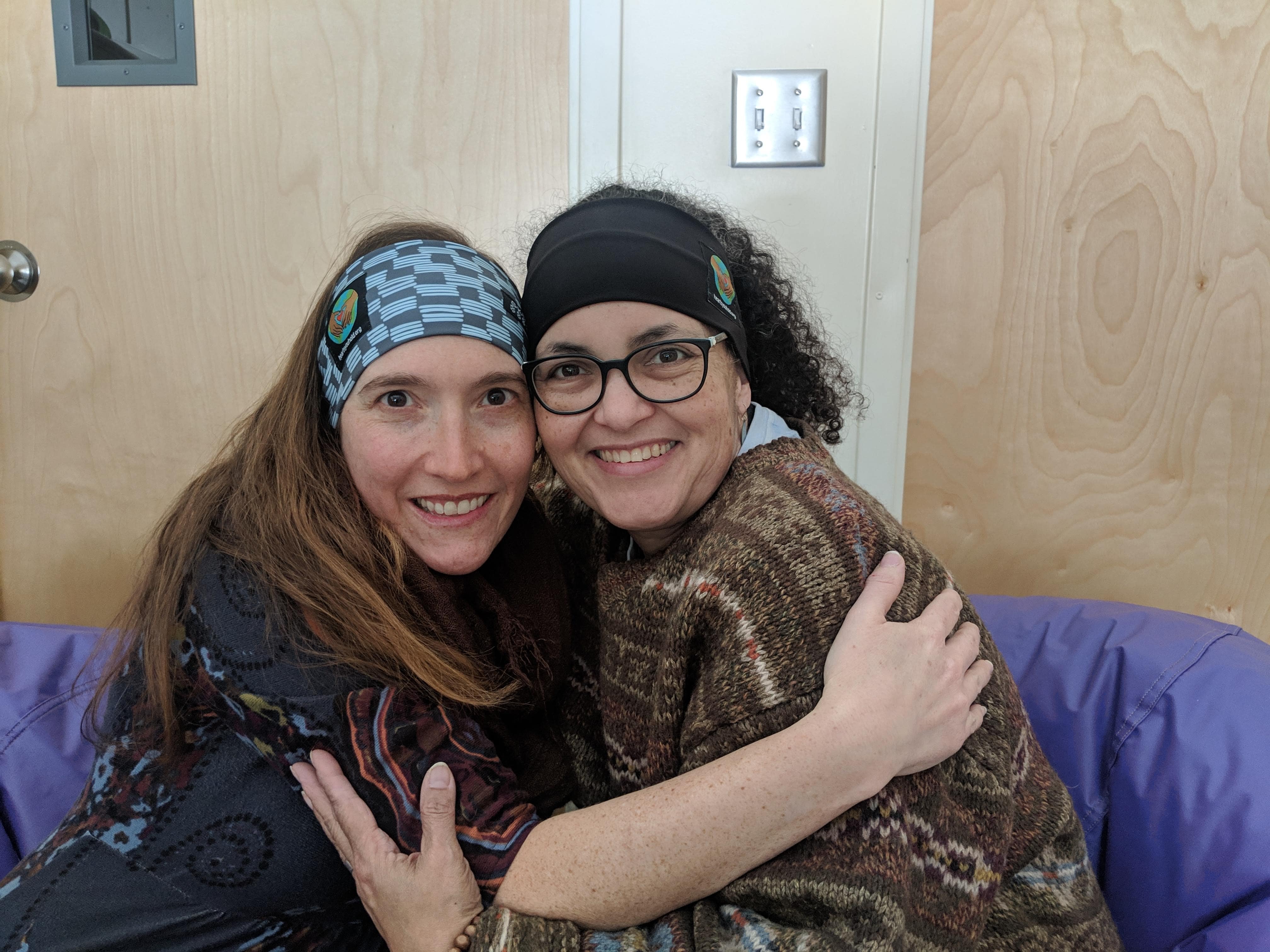 Two individuals hugging